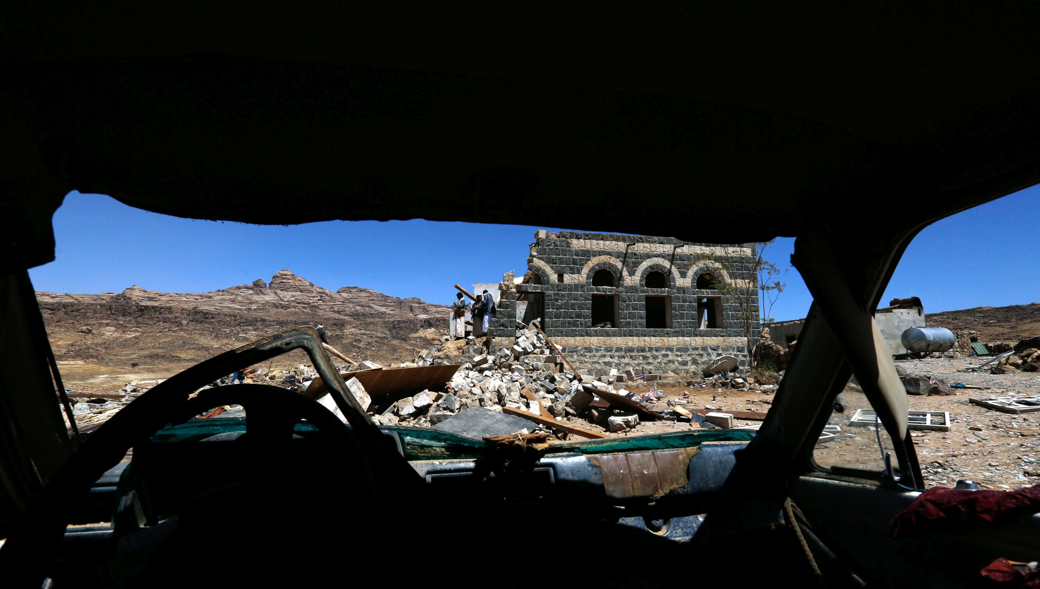 epa05797191 Yemenis inspect a destroyed house after an alleged Saudi-led airstrike hit a funeral reception on the northern outskirts of Sanaa, Yemen, 16 February 2017. According to reports, eight Yemeni women and a child have reportedly been killed and at least 10 more women wounded in an overnight airstrike allegedly carried out by the Saudi-led coalition a funeral reception near Yemen's rebel-held capital Sana'a.  EPA/YAHYA ARHAB