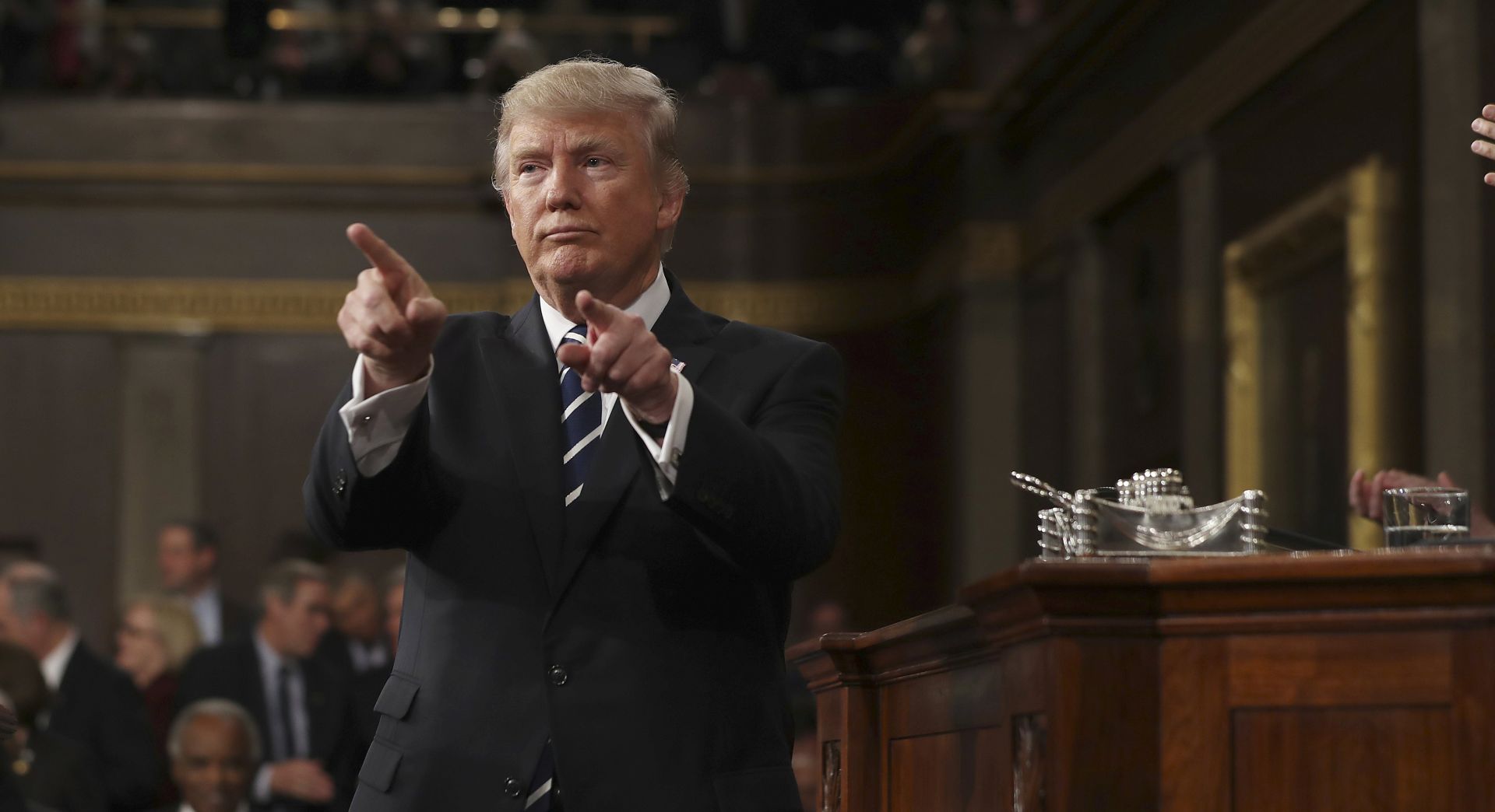 epa05821918 US President Donald J. Trump reacts after delivering his first address to a joint session of Congress from the floor of the House of Representatives in Washington, DC, USA, 28 February 2017. Traditionally the first address to a joint session of Congress by a newly-elected president is not referred to as a State of the Union.  EPA/JIM LO SCALZO / POOL