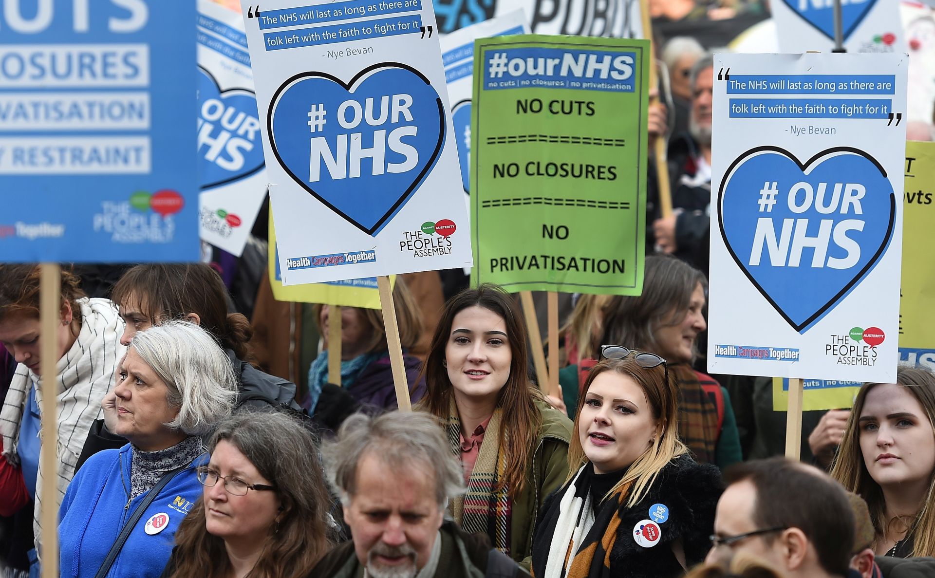 epa05828820 'Our NHS' demonstrators march toward parliament in London, Britain, 04 March 2017. Tens of thousands of protesters marched on parliament during a national demonstration calling for the government to defend the National Health Service (NHS).  EPA/ANDY RAIN