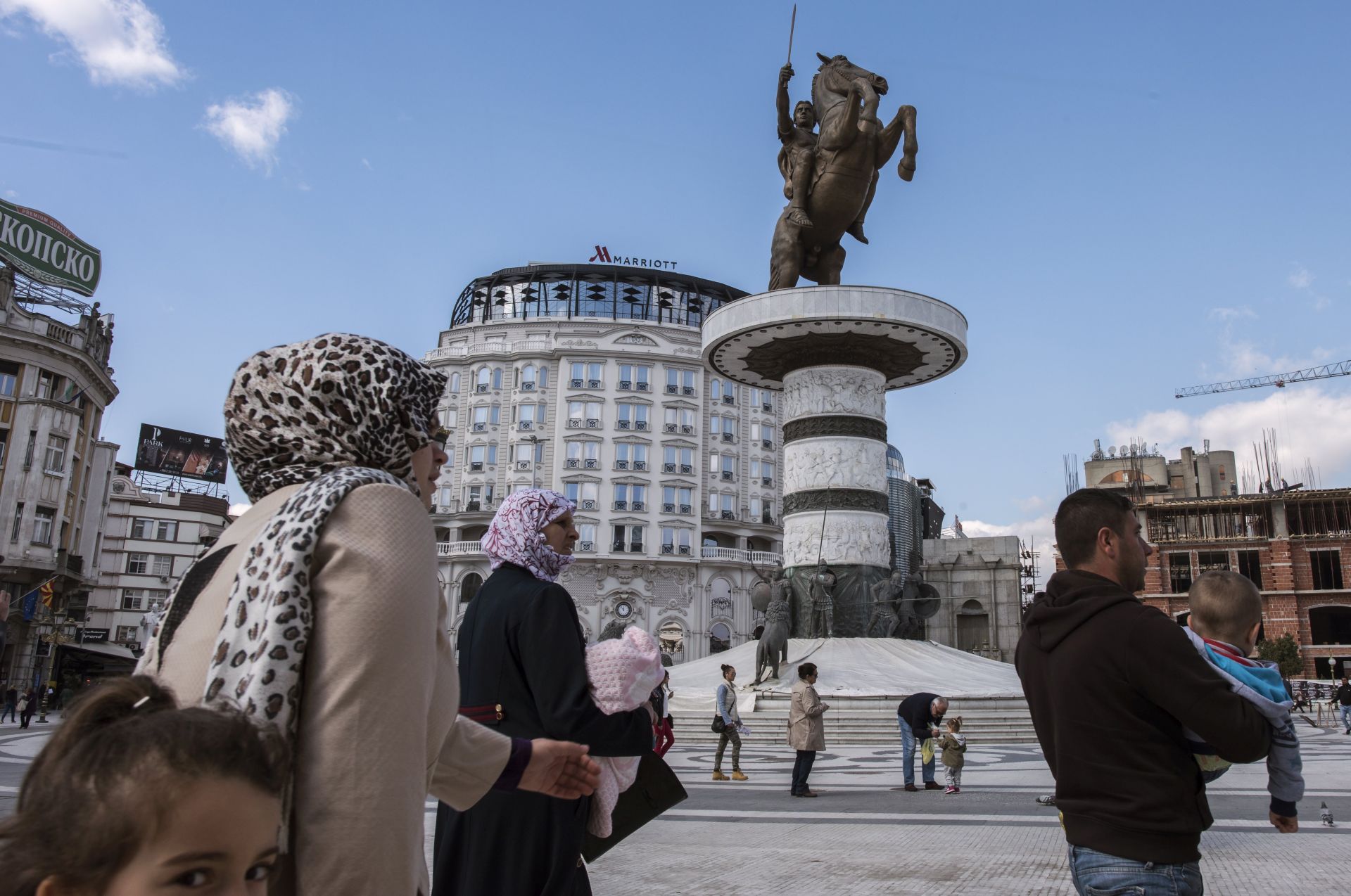 epa05832772 People walk in the main square of Skopje, The Former Yugoslav Republic of Macedonia, 06 March 2017. The Ministers of Foreign Affairs of the European Union member countries will hold a meeting to discuss the situation in the western Balkan countries. The political situation in Macedonia is at an impasse due to the President Gjorge Ivanov's opposition to a coalition of Social Democrat and ethnic Albanian political parties forming a government.  EPA/GEORGI LICOVSKI