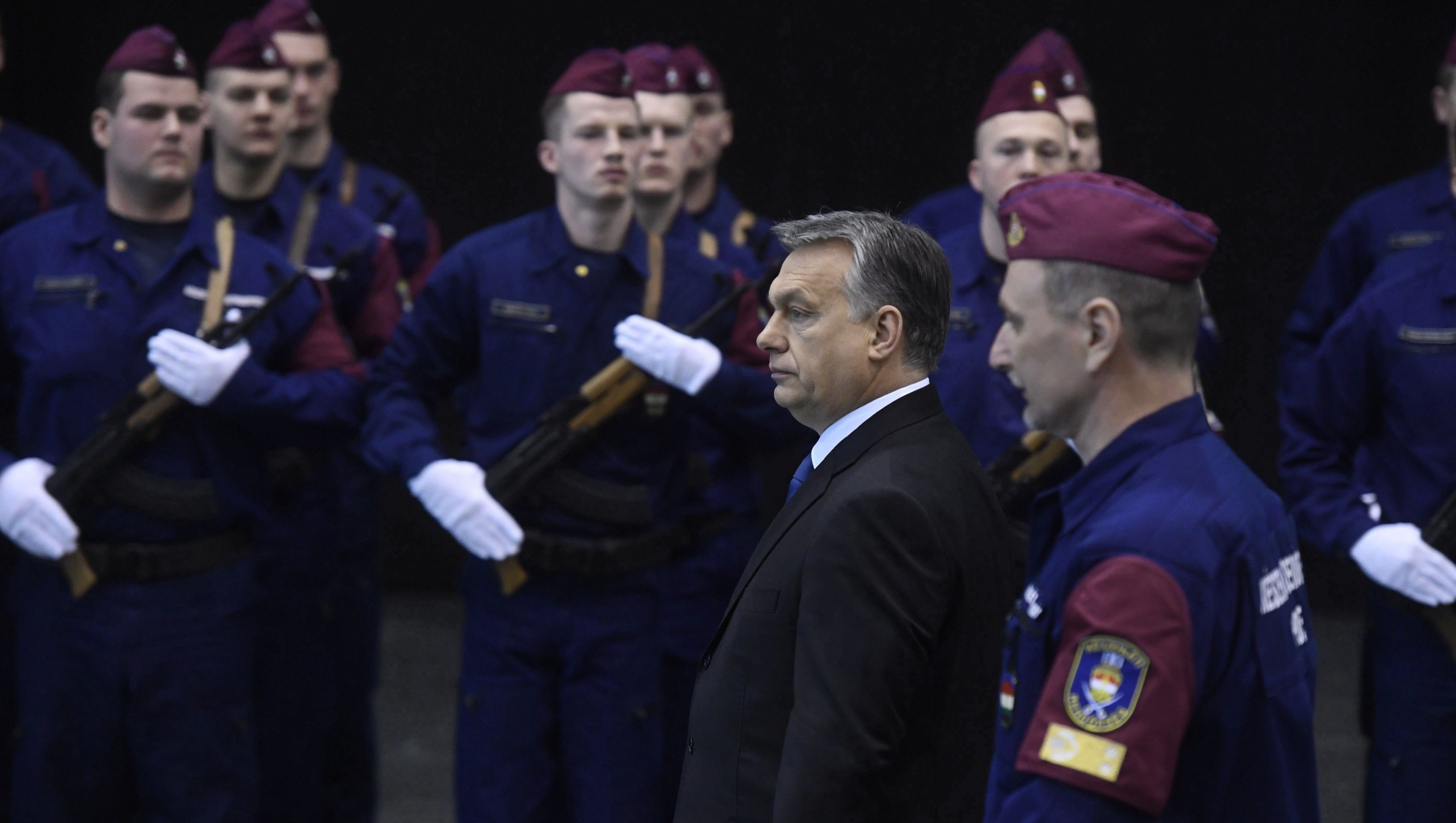epa05834086 Hungarian Prime Minister Viktor Orban (C) arrives to the swearing-in ceremony of new non-commissioned officers of the border guard division of the Hungarian operational police force in Budapest, Hungary, 08 March 2017. The inaugurated officers will be deployed along the country's southern borders to help prevent illegal migration into Hungary.  EPA/SZILARD KOSZTICSAK HUNGARY OUT