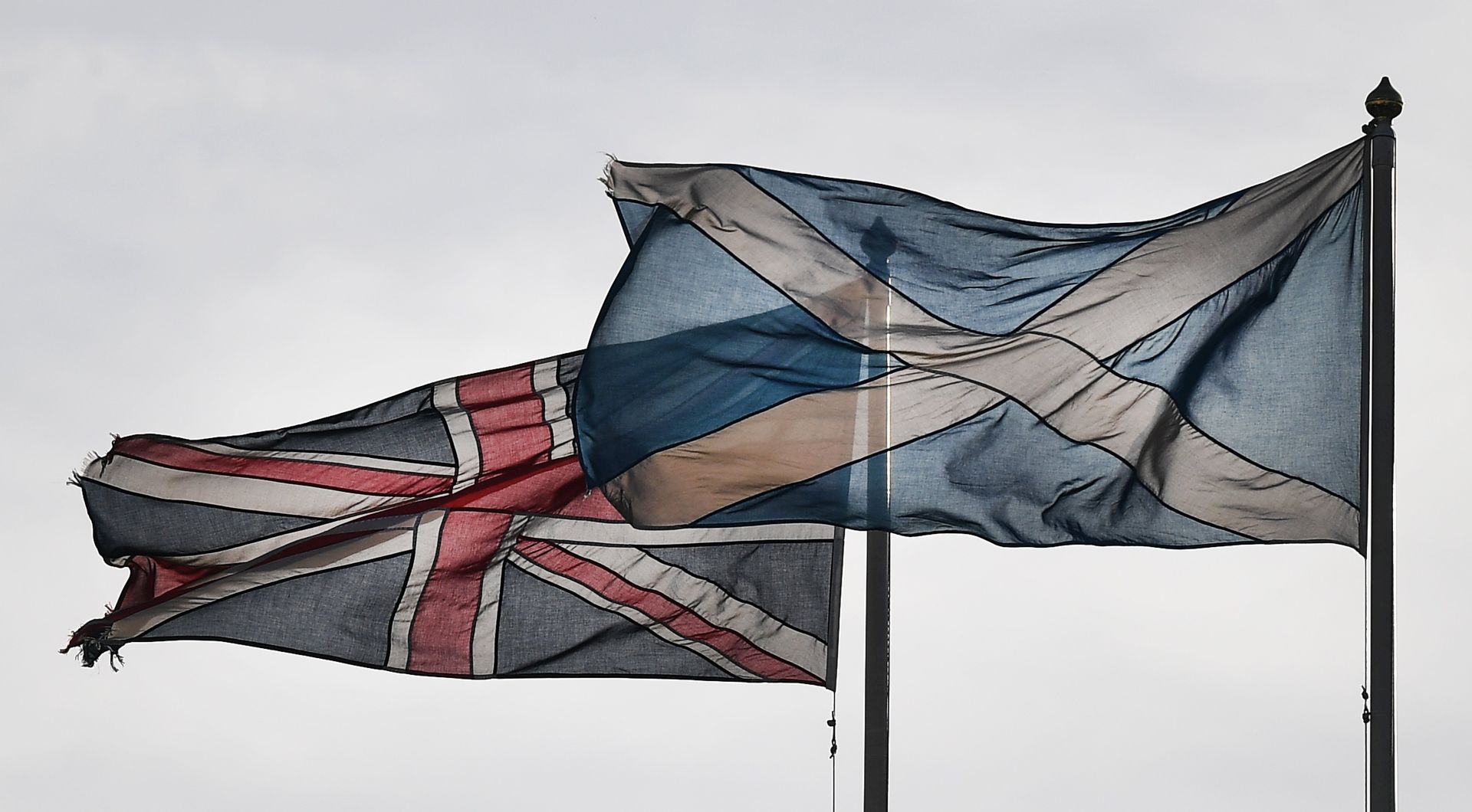 epa05846270 The Union Flag (L) and the Saltire, the national flag of Scotland (R), fly over Whitehall in London, Britain, 13 March 2017.  Scotland's First Minister Nicola Sturgeon announced during a speech 13 March that she will seek permission for a second Independence Referendum. It was reported to most likely be held in late 2018 or the spring of 2019.  EPA/ANDY RAIN