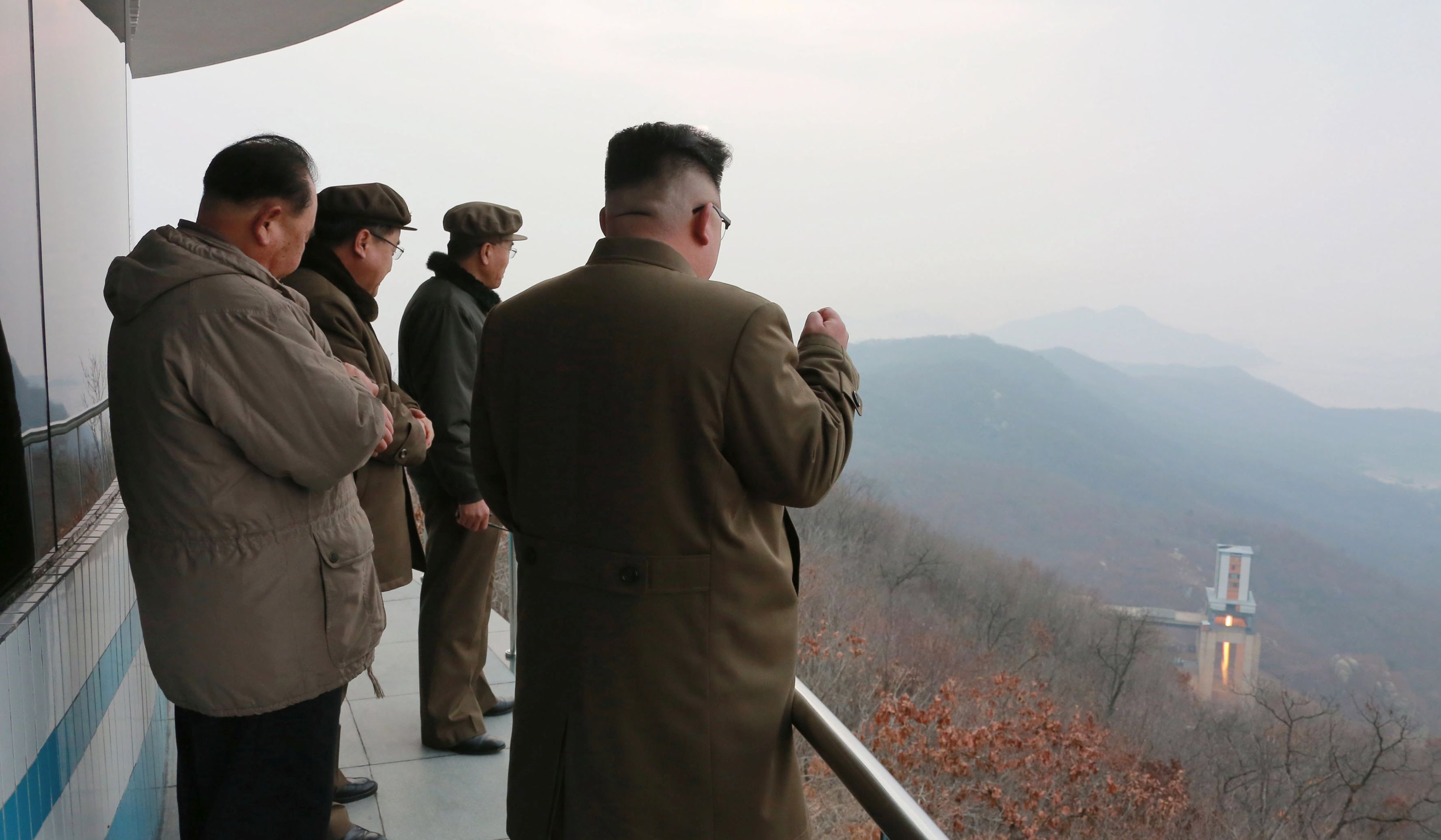 epa05857469 A photograph released by the North Korean Central News Agency (KCNA) shows North Korean leader Kim Jong-un (R) watching the ground jet test of a high-thrust engine at an undisclosed location in North Korea, 19 March 2017. According to media reports on 19 March 2017, North Korea announced a successful test of a high-thrust rocket engine.  EPA/KCNA   EDITORIAL USE ONLY