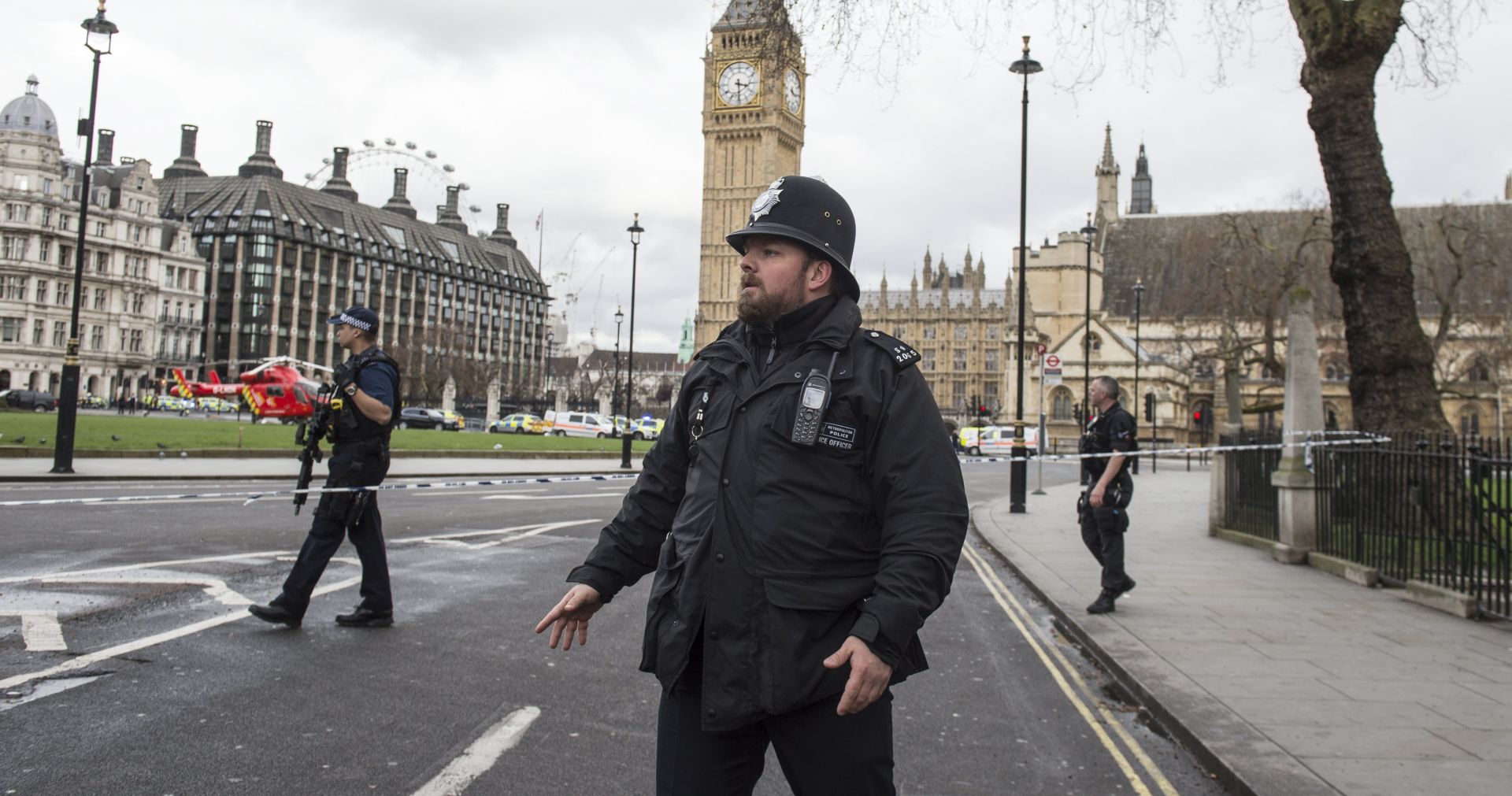 epa05863739 A London police office following major incidents outside the Houses of Parliament in central London, Britain 22 March 2017. Scotland Yard said on 22 March 21017 the police were called to a firearms incident in the Westminister palace grounds and on Westminster Bridge amid reports of several people injured in central London.  EPA/WILL OLIVER