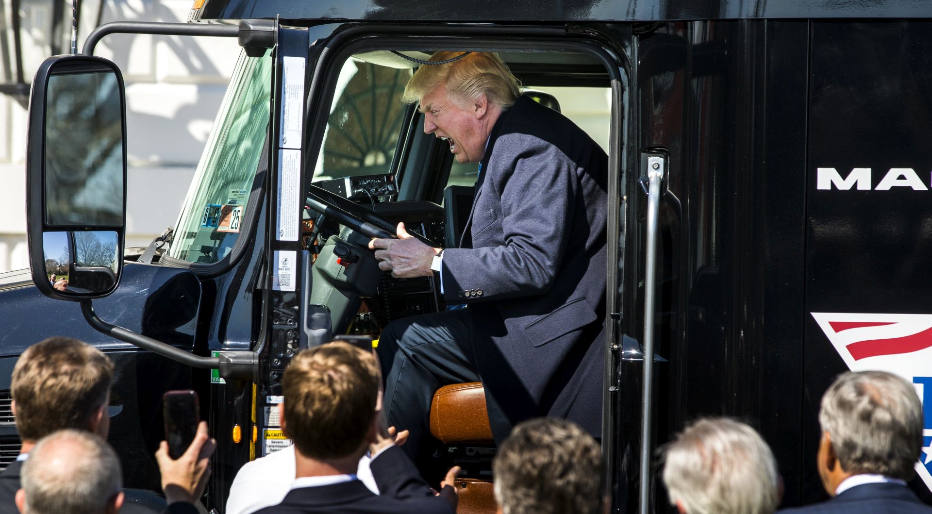 epa05866651 US President Donald J. Trump gets in the driver's seat of an 18-wheeler while meeting with truck drivers and trucking CEOs on the South Portico prior to their meeting to discuss health care at the White House in Washington, DC, USA, 23 March 2017.  The House of Representatives has yet to vote on the Republican-crafted American Health Care Act, that would replace the Affordable Care Act, as it remained unclear whether Republicans had enough votes to overcome opposition from Democrats and those within their own party.  EPA/JIM LO SCALZO