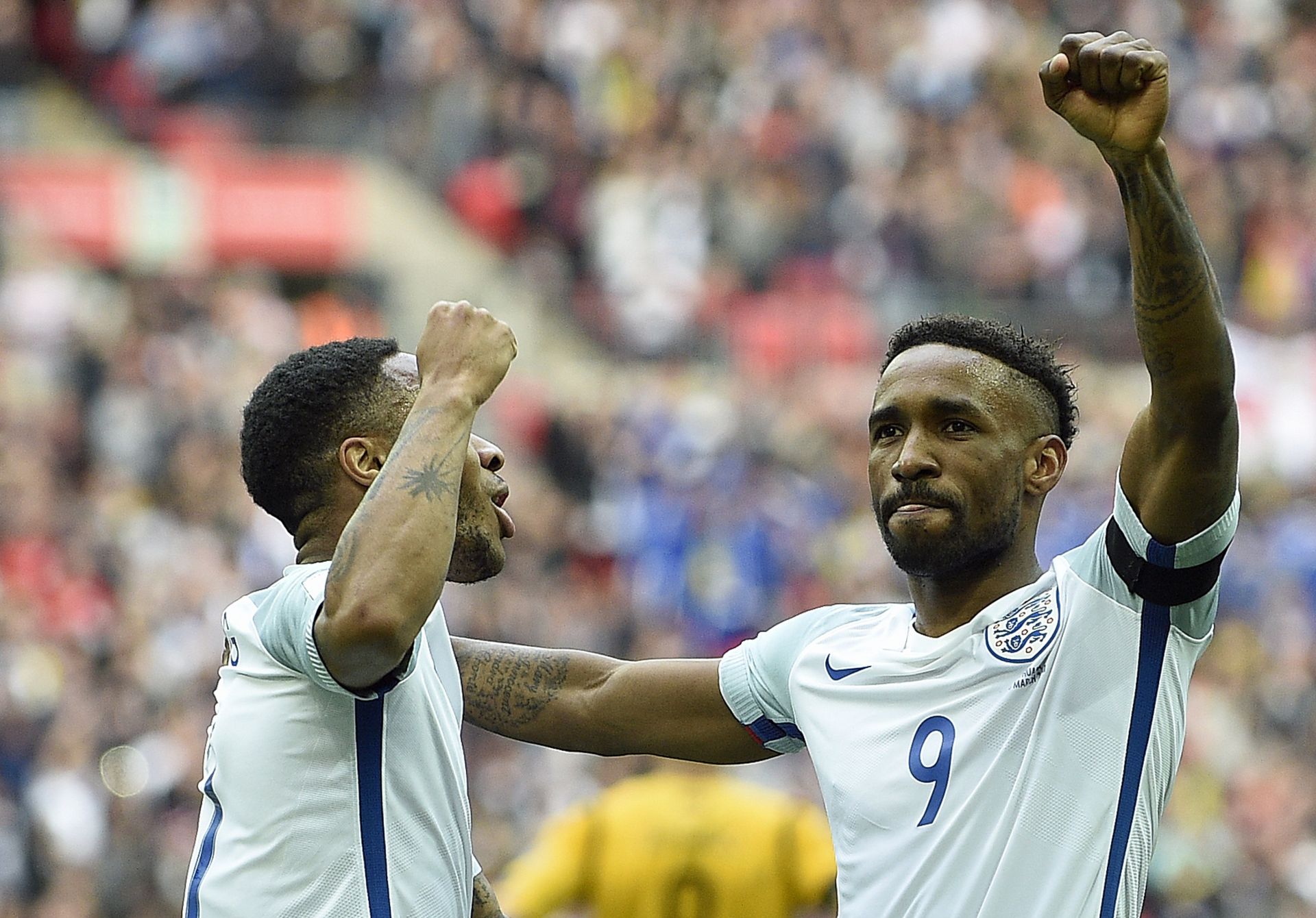 epa05872185 England's Jermain Defoe celebrates scoring their first goal against Lithuania with goal maker Raheem Sterling (L) during the FIFA World Cup 2018 qualifing group F match England vs Lithuania at Wembley Stadium, London, 26 March 2017.  EPA/GERRY PENNY