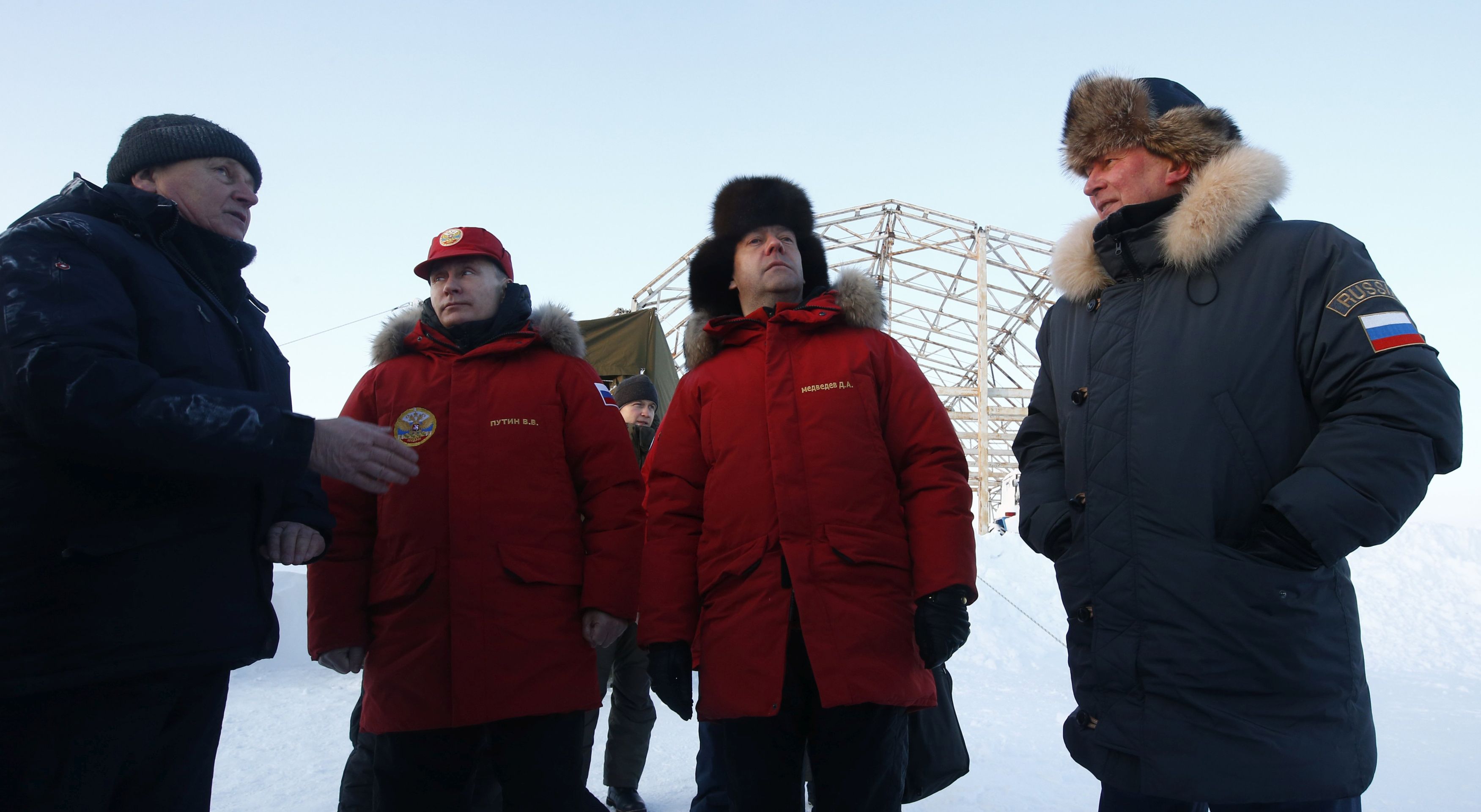 epa05878306 Russian President Vladimir Putin (2-L), Russian Prime Minister Dmitry Medvedev (2-R) and Russian President's special representative for Nature Protection, the Environment and Transport Sergei Ivanov (R) visit Alexandra Land in remote Arctic islands of Franz Josef Land, Russia, 29 March 2017 (issued 30 March 2017). Vladimir Putin made a visit to inspect the progress of the elimination of environmental damage in the Russian Arctic zone.  EPA/SERGEI KARPUKHIN / POOL