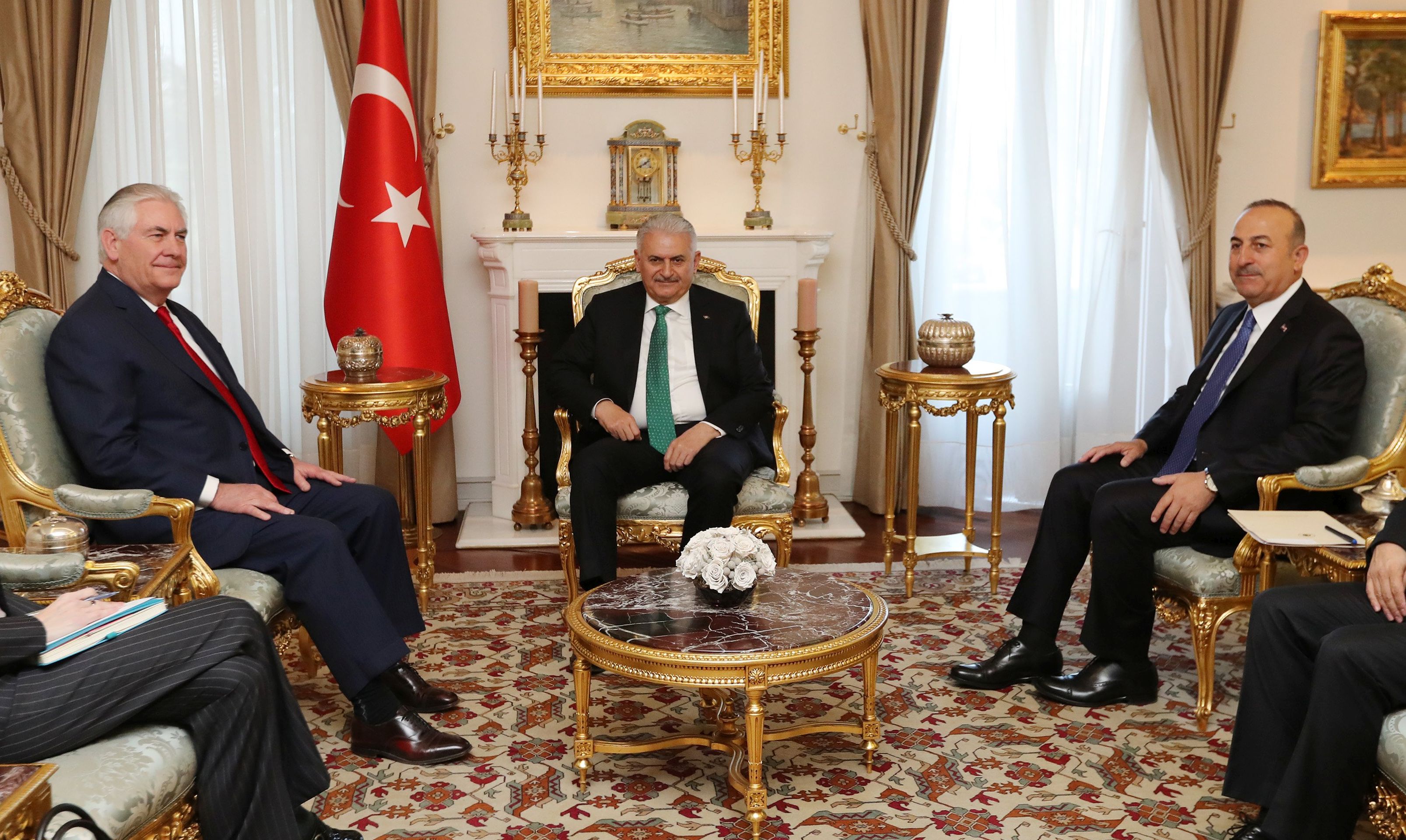 epa05878398 A handout photo made available by the Turkish Prime Minister Press Office shows US Secretary of State Rex Tillerson (L) meeting with Turkish Prime Minister Binali Yildirim (C) in Ankara, Turkey, 30 March 2017. Tillerson is on an official visit to Ankara where he is expected to meet with Turkish President Recep Tayyip Erdogan and other senior Turkish government officials. In picture at right is seen Turkish Foreign Minister Mevlut Cavusoglu.  EPA/TURKISH PRIME MINISTER PRESS OFFICE HANDOUT  HANDOUT EDITORIAL USE ONLY/NO SALES