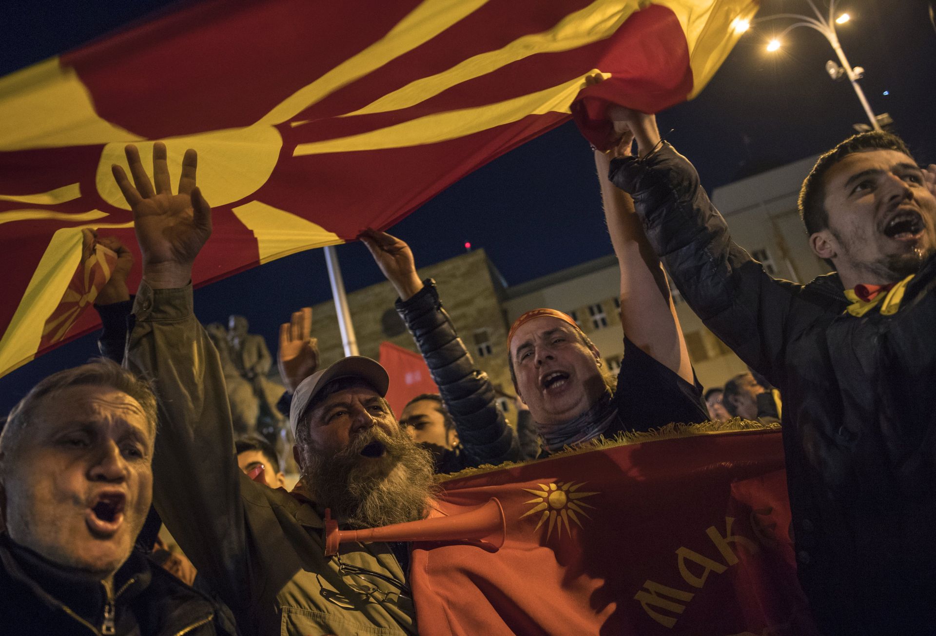 epa05821371 Supporters of the Civil Initiative for United Macedonia wave the national flag and shout the slogans during the protest in front of the Government building in Skopje, The Former Yugoslav Republic of Macedonia, 28 February 2017. Macedonian citizens organized by the 'Civil Initiative for United Macedonia' mobilized for protests against possible government between the opposition Social democrats and the main Albanian party, Democratic Union for Integration, claiming that their coalition deal that includes Albanian becoming an official language, will break up the country. The protest comes after VMRO-DPMNE's leader Nikola Gruevski called on the people on 26 February, to defend the country he alleges is under attack.  EPA/GEORGI LICOVSKI