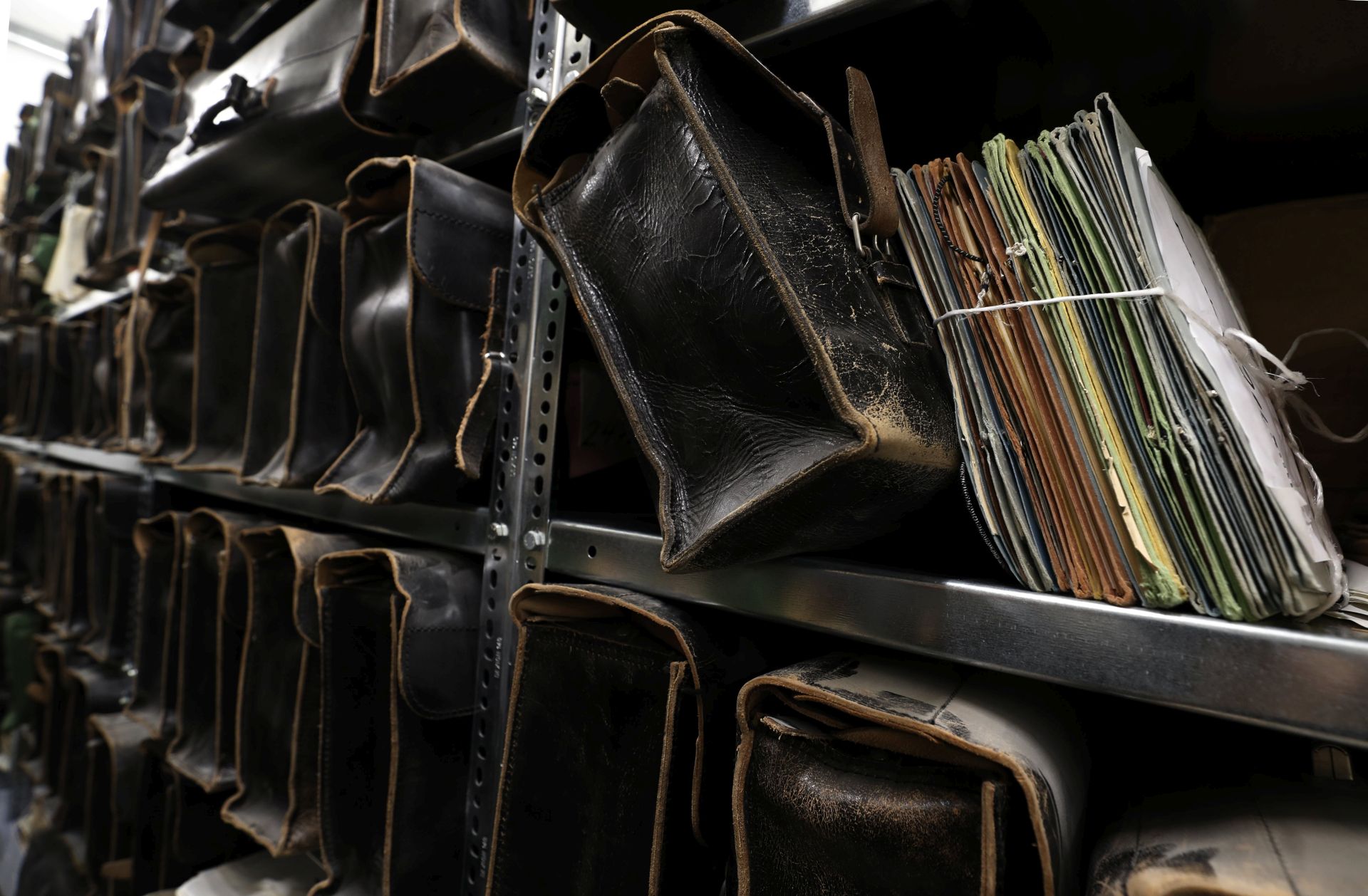 epa05807618 View of folders and suitcases in a gallery with information on thousands of people, who had been under surveillance by the former Ministry for State Security (Stasi) of the German Democratic Republic (GDR) in the Stasi Museum, in Berlin, Germany, 21 February 2017. Stasi Museum since 1990 serves as a research and memorial centre investigating the political system of the former East Germany. 25 years ago the German Government ruled the declassification of the Stasi records and made them available to public access. Since then German citizens can request for possible surveillance files the Government of the GDR could gather about them.  EPA/FELIPE TRUEBA