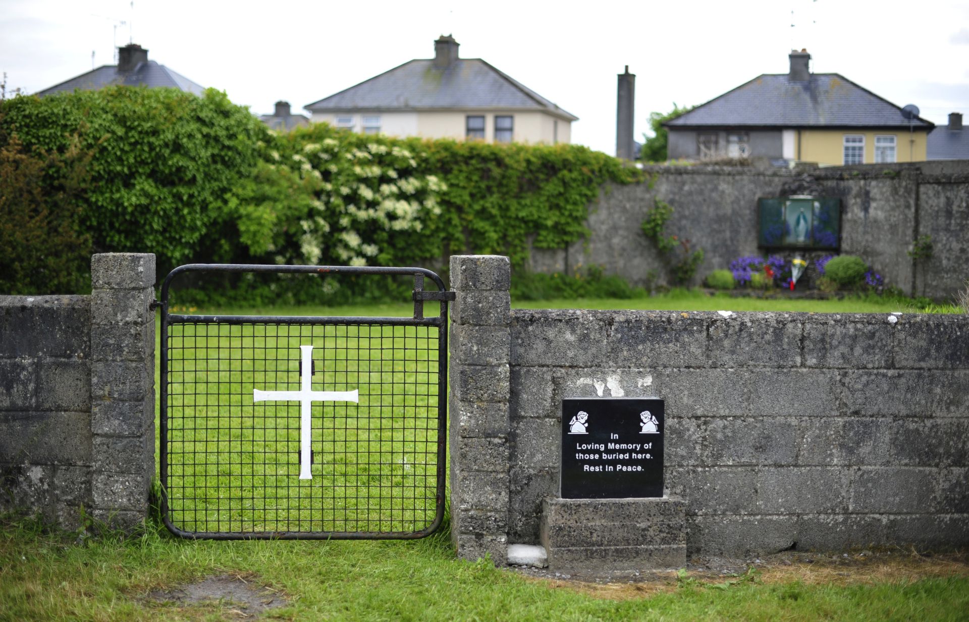 epa05827204 (FILE) A file photo from 6 June 2014 of the entrance to the site of a mass grave of up to 800 children at the former Mother and Baby home in Tuam, County Galway, in western Ireland.  It was revealed 3 March 2017 by the Mother and Baby Homes Commission that a mass grave containing the remains of babies has been discovered at the former orphanage. The commission announced that excavations at the site in Tuam found 20 chambers underground containing large quanitites of human remains.  EPA/AIDAN CRAWLEY