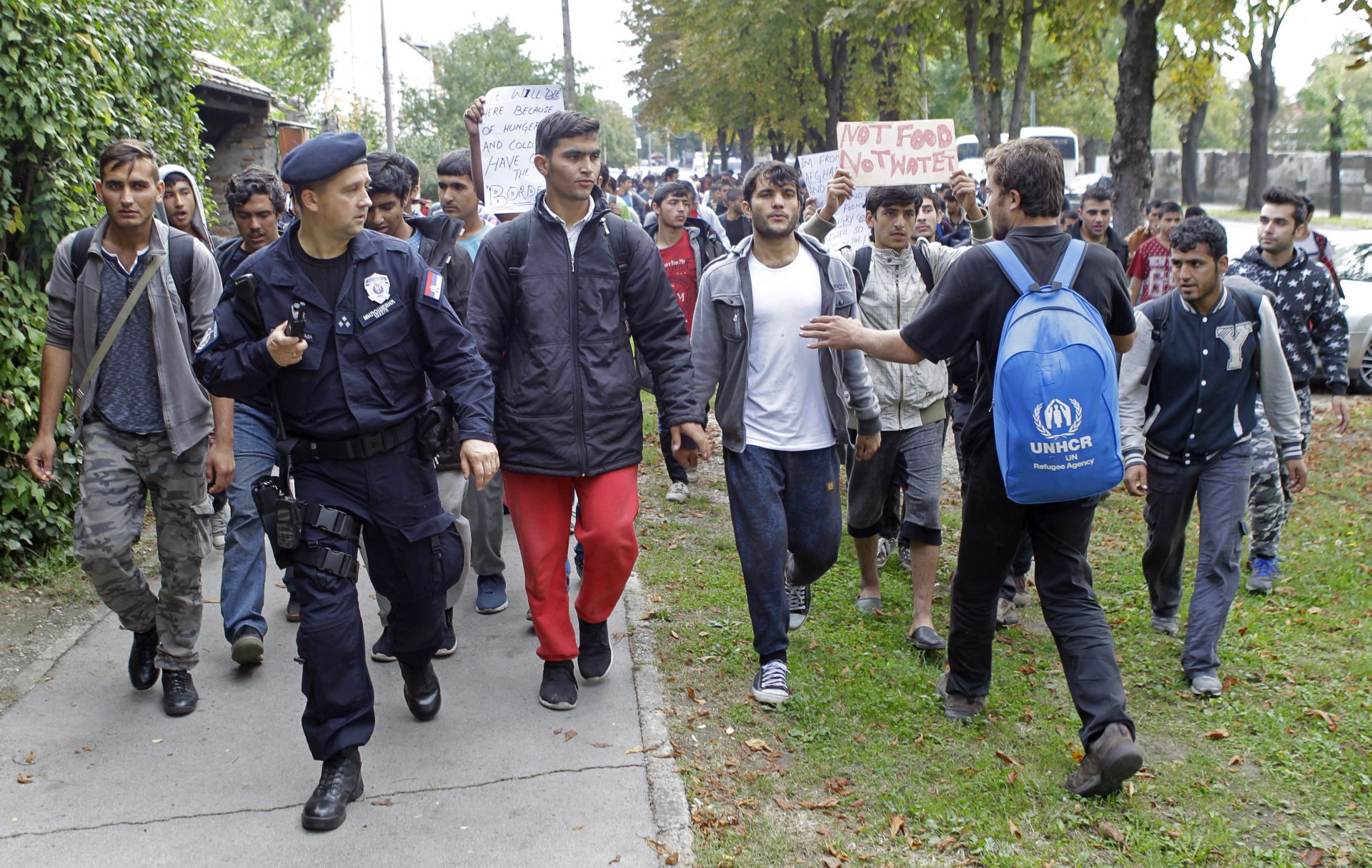 epa05569403 Hundreds of migrants march trough Belgrade, Serbia, 04 October 2016. According to reports, hundreds of migrants from Middle East countries marched through the Serbian capital, apparently trying to move towards Hungary, in order to reach western European countries. A day earlier, Serbian President Tomislav Nikolic stated that Serbia will also close its borders after the Balkan route was effectively closed.  EPA/ANDREJ CUKIC