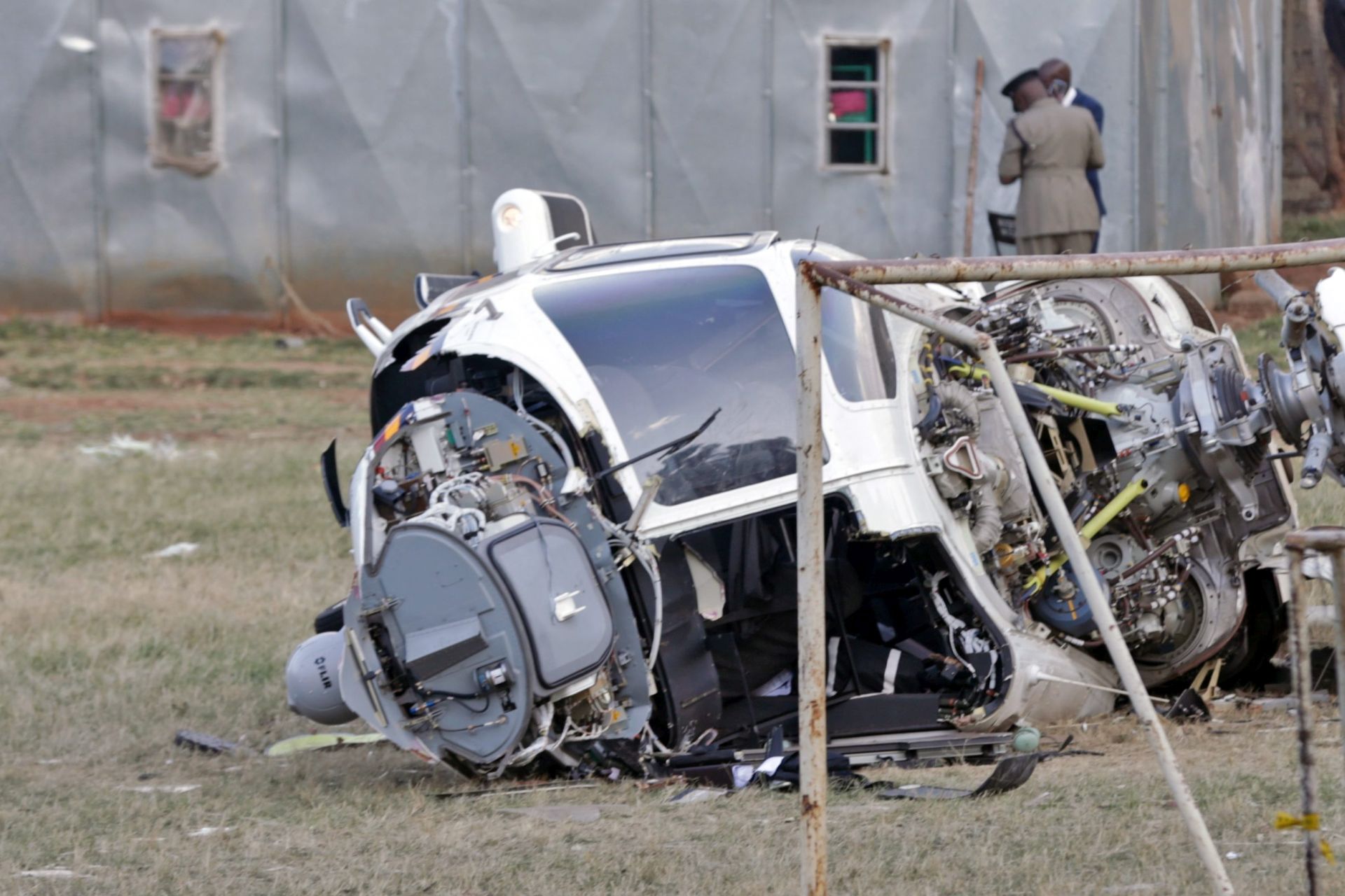 epa05530617 Police officers patrol at the scene of a Kenya Police chopper that crashed inside National Youth Service (NYS) compound in Nairobi, Kenya, 08 September 2016. According to local media, the AgustaWestland 139 helicopter was recently acquired and it is said to have developed mechanical problems in the air and stayed in the air for estimated 10 to 20 minutes before it crashed, where 4 police officers were injured and taken to hospital. This is the second plane crash after a fixed wing Cessna plane crashed and bursts into flames after take-off in Naivasha, a town outside Nairobi, on 08 September 2016 where it killed one person and injured 5 others.  EPA/DANIEL IRUNGU