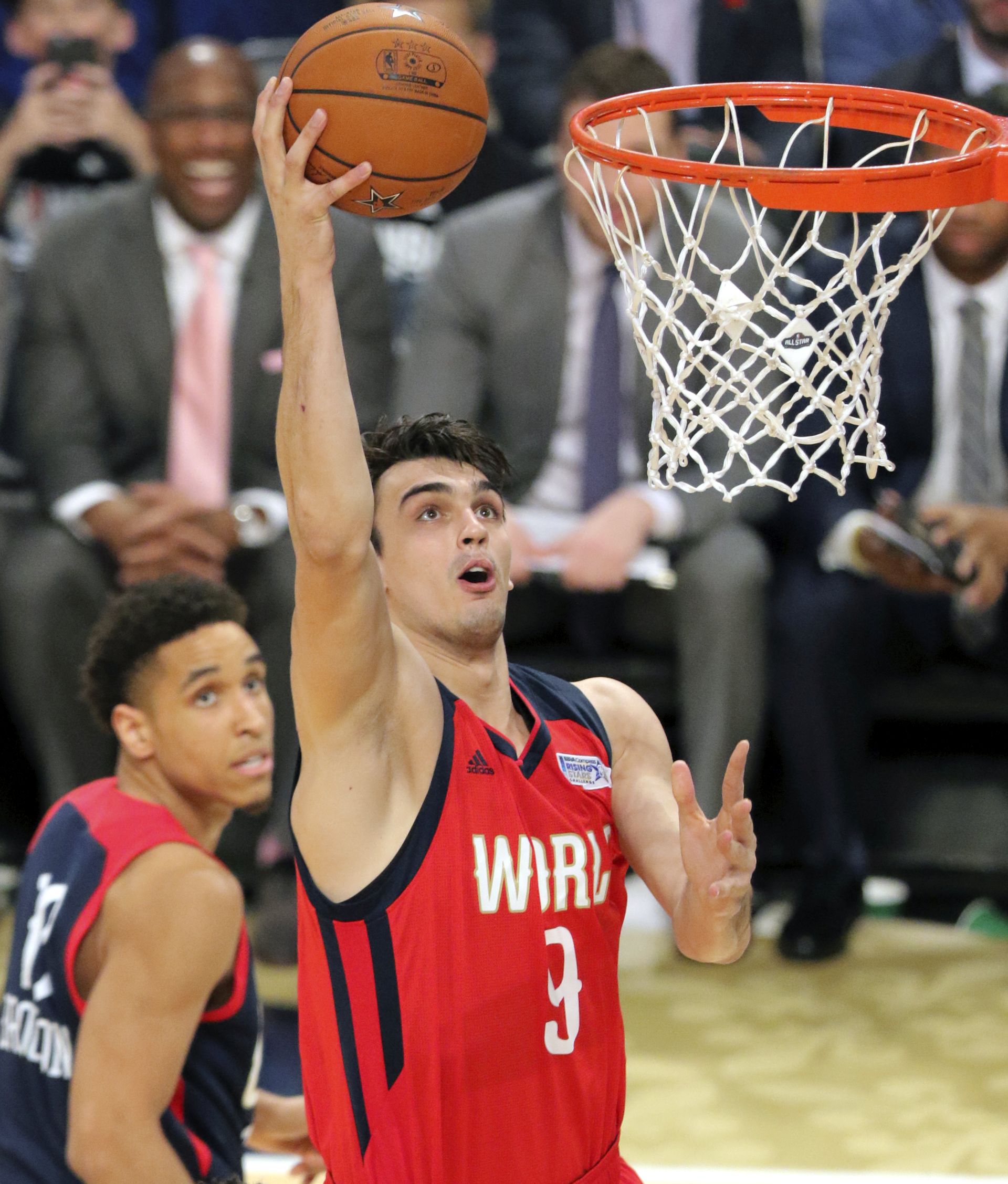 epa05800965 World Team player Dario Saric of Croatia goes to the basket against the United States team during the NBA Rising Stars Challenge at Smoothie King Center, part of the NBA All-Star weekend in New Orleans, Louisiana, 17 February 2017. The NBA All-Star Game will be played 19 February in New Orleans.  EPA/DAN ANDERSON