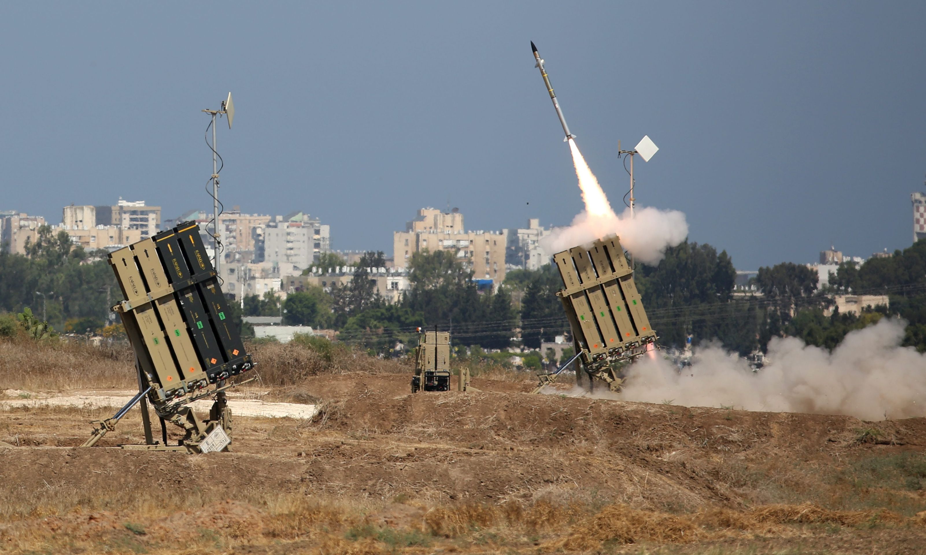 epa04304713 An Israeli Iron Dome defense system missile is fired to intercept a rocket fired from Gaza over the city of Ashdod, southern Israel, 08 July 2014. Israel launched a major military offensive against the Gaza Strip early 08 July 2014 in response to increasing rocket attacks by Palestinian militants. The Israel Air Force bombed about 50 targets overnight, military spokesman Peter Lerner said. He warned that Israel would gradually increase the "quantity and quality" of its targets, stepping up pressure.  EPA/ABIR SULTAN