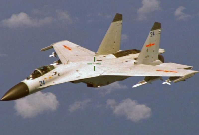 epa04368174 A handout photo provided by the Office of the US Secretary of Defense on 25 August 2014 shows a purported Chinese J-11 fighter aircraft as it allegedly tracks a US Navy P-8 surveillance plane over the South China Sea on 19 August 2014. The United States on 22 August charged that a Chinese war plane made a 'dangerous intercept' of a US Navy aircraft over international waters in the South China Sea. The US registered 'strong concerns' with the Chinese government about 'unsafe and unprofessionalconduct that put the safety of the US crew at risk, said Rear Admiral John Kirby, the Pentagon spokesman. It was the latest in a long series of confrontations between China and other countries over air and sea control in the region.  EPA/OFFICE OF THE SECRETARY OF DEFENSE / HANDOUT  HANDOUT EDITORIAL USE ONLY