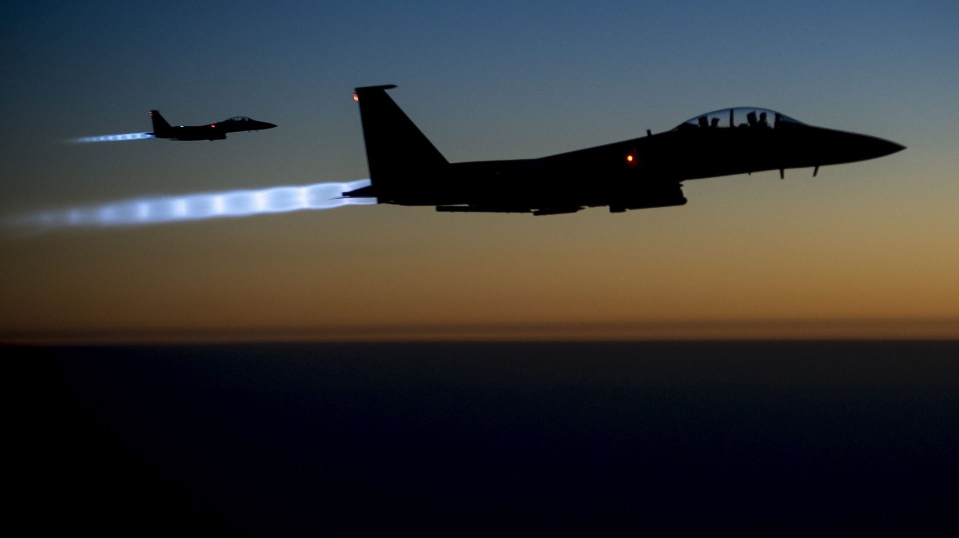 epa04422741 A handout picture made available by the US Department of Defense (DoD) on 29 September 2014 shows a pair of US Air Force F-15E Strike Eagles flying over northern Iraq early in the morning of 23 September 2014, after conducting airstrikes in Syria. These aircraft were part of a large coalition strike package that was the first to strike Islamic State (IS or ISIL) targets in Syria. Al-Nusra, a branch of al-Qaeda operating in Syria, was hit by US airstrikes on 23 September, the same day the US and allies launched raids against the Islamic State group, which split from al-Qaeda last year and has seized swathes of Syria and neighboring Iraq. The US Congress has also authorized the equipping and training of moderate Syrian rebel groups who are to fight Islamic State militants on the ground. But even some moderate rebel groups have reacted angrily to the strikes against al-Nusra, asking why they are not receiving more military aid and arguing that regime forces should also be targeted. The Britain-based Syrian Observatory for Human Rights said al-Jaulani's group lost 57 fighters in the raids. The US said it was targeting a network of al-Qaeda veterans who were preparing overseas attacks. US president Barack Obama blamed instability in Syria for giving extremists space to thrive. In an interview on 28 September, Obama said his director of national intelligence already had acknowledged that US intelligence underestimated what had been taking place in Syria.  EPA/HANDOUT EDITORIAL USE ONLY