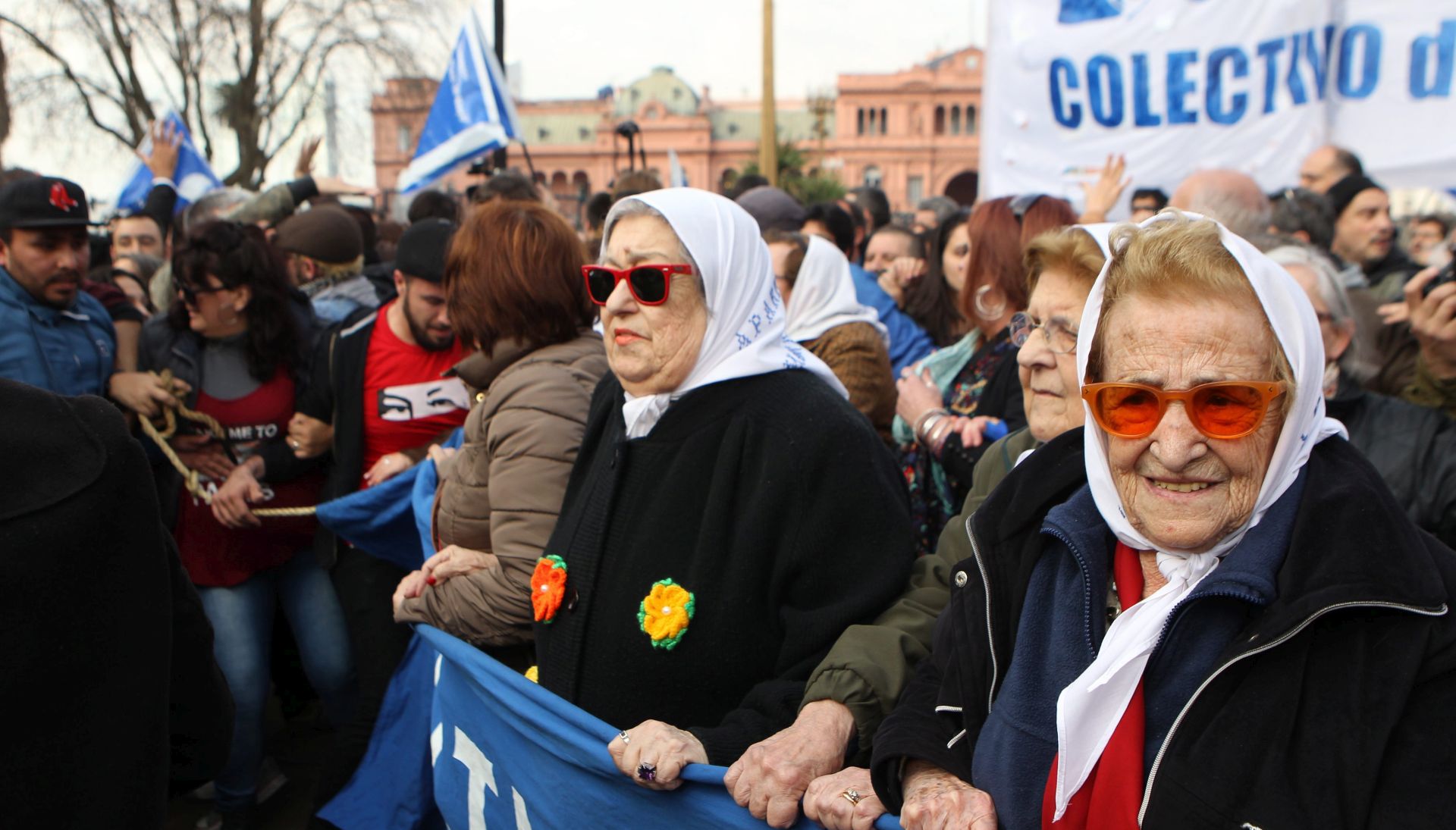 epa05455920 Hebe de Bonafini (C), President of the Argentinian association 'Madres de Plaza de Mayo' (May's Square Mothers), takes part in a demonstration after rejecting to appear before a judge in Buenos Aires, Argentina, 04 August 2016. Bonafini, 87, has reportedly resisted an arrest warrant by boarding a mini-van after a judge ordered her arrest as she refused twice to appear in a court to give evidence over an alleged political corruption case for the mismanagement of millions of dollars in a low-income housing project, media reported. The Mothers of Plaza de Mayo, a human rights group, has been fighting for justice for the victims of the 1976-83 military regime in Argentina.  EPA/ALBERTO ORTIZ