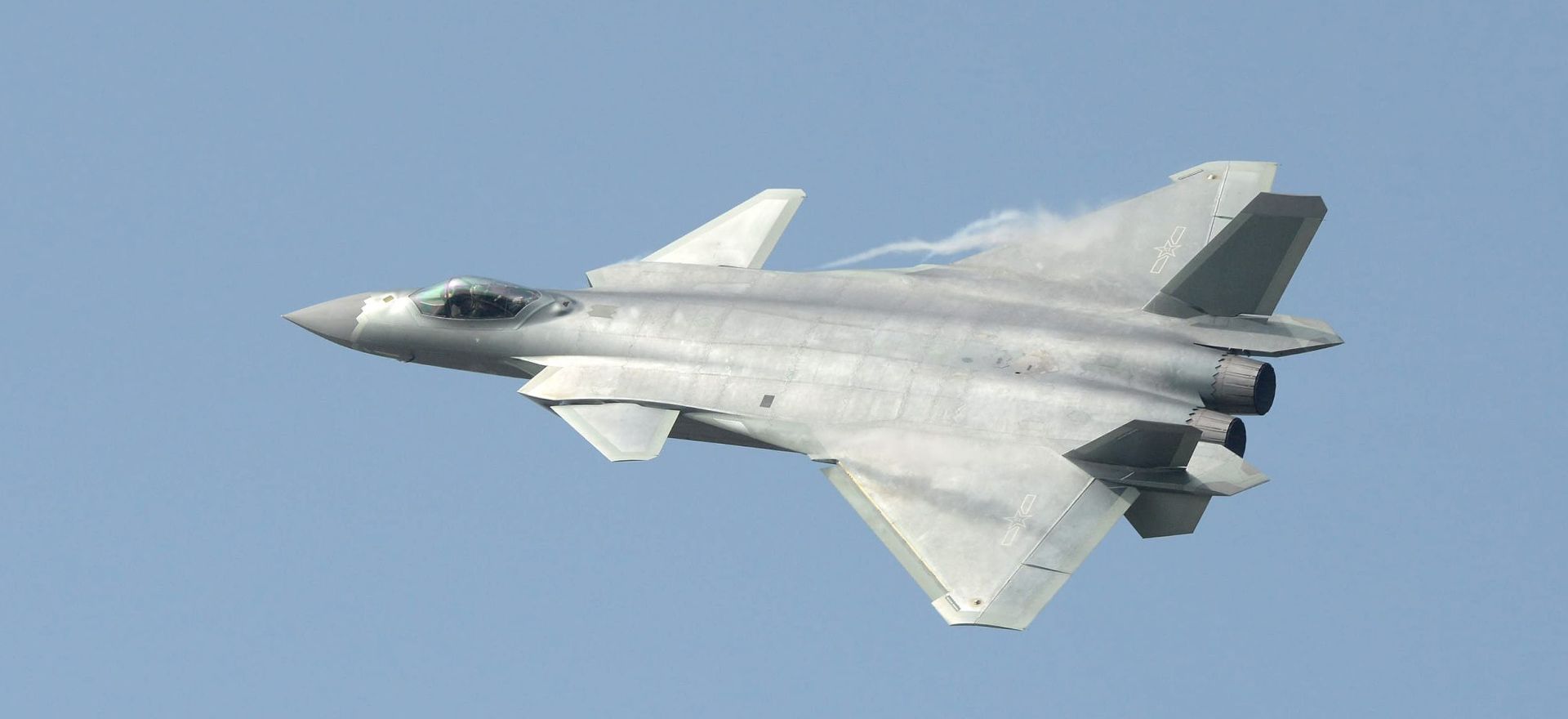 epa05612118 China's new J-20 stealth fighter flies during an airshow at the China International Aviation & Aerospace Exhibition in Zhuhai, Guangdong Province, China, 01 November 2016. The J-20 is the second stealth aircraft developed by China after the Shenyang J-31, which was presented at the last edition of the Zhuhai Airshow in 2014.  EPA/YhC