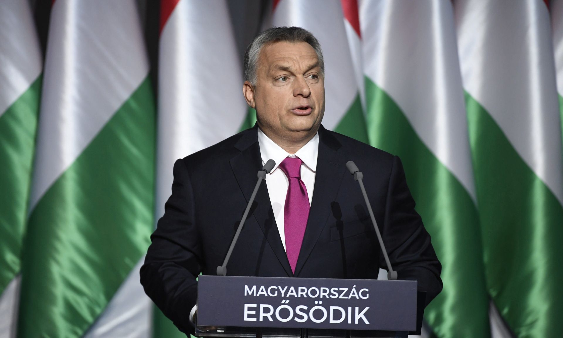 epa05783058 Hungarian Prime Minister Viktor Orban delivers his annual 'State of Hungary' speech in the Varkert Bazar (Castle Gardens Bazaar), at the foot of Castle Hill in Budapest, Hungary, 10 February 2017. The inscription on the podium reads: 'Hungary is getting stronger'.  EPA/SZILARD KOSZTICSAK HUNGARY OUT
