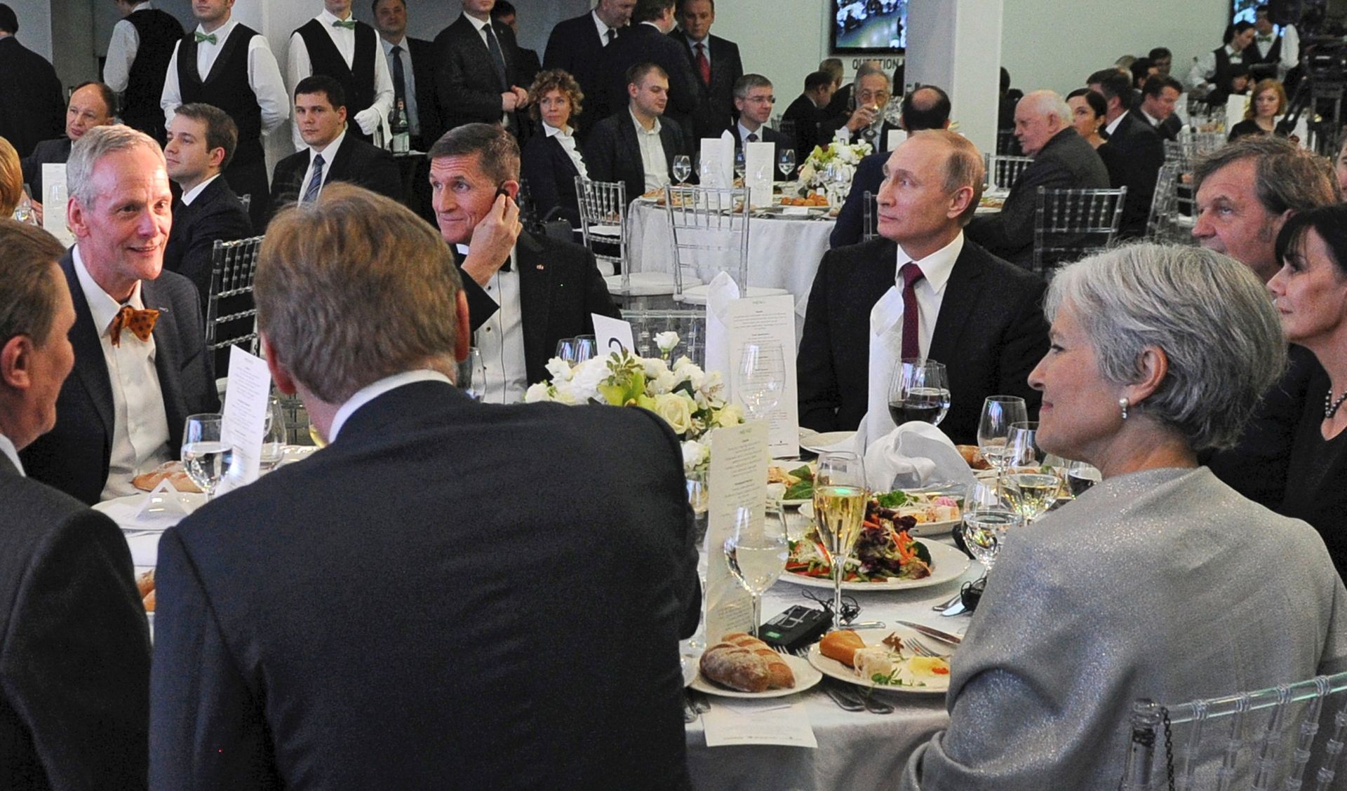 epa05794633 A picture made available on 15 February 2017 shows Russian President Vladimir Putin (C-R) and then retired US Army Lieutenant General Michael T. Flynn (C-L) attend an exhibition marking the 10th anniversary of RT (Russia Today) TV news channel in Moscow, Russia, 10 December 2015. Flynn on 14 February 2017 resigned from his position as US President Trump's National Security Advisor - though media also report that Trump fired him - after facing increased scrutiny due to reports that the Justice Department contacted the White House in regards to Flynn's alleged pre-inauguration conversations with the Russian ambassador concerning sanctions.  EPA/MICHAEL KLIMENTYEV / SPUTNIK / KREMLIN POOL MANDATORY CREDIT