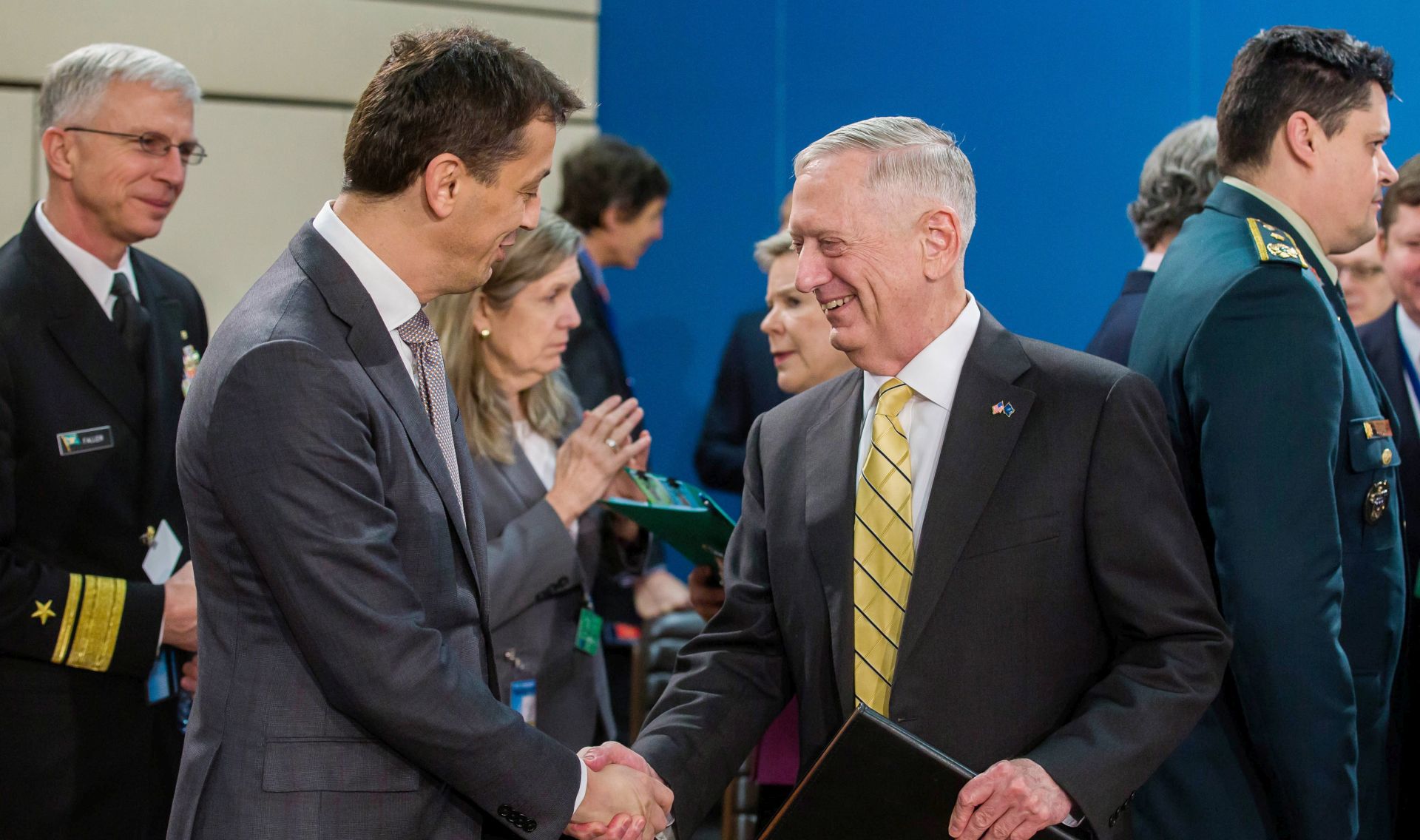 epa05796199 Montenegro's Defence Minister Predrag Boskovic (L-2) and US Defence Minister James Mattis (R-2), shake hands on the second day of the NATO Defense Ministers council at Alliance headquarters, in Brussels, Belgium, 16 February 2017. Nato defense ministers are gathering for a two-day meeting.  EPA/STEPHANIE LECOCQ