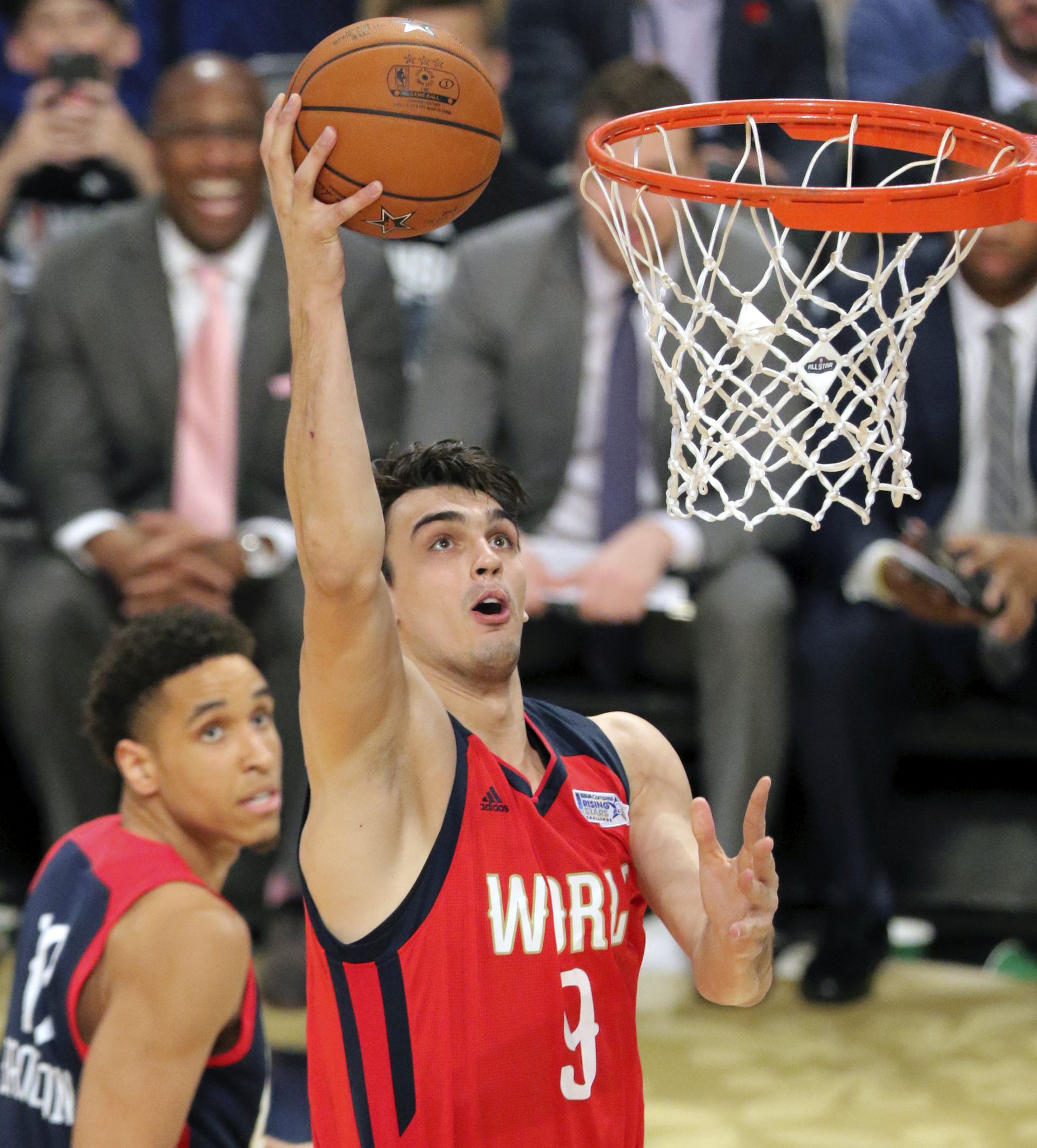 epa05800965 World Team player Dario Saric of Croatia goes to the basket against the United States team during the NBA Rising Stars Challenge at Smoothie King Center, part of the NBA All-Star weekend in New Orleans, Louisiana, 17 February 2017. The NBA All-Star Game will be played 19 February in New Orleans.  EPA/DAN ANDERSON