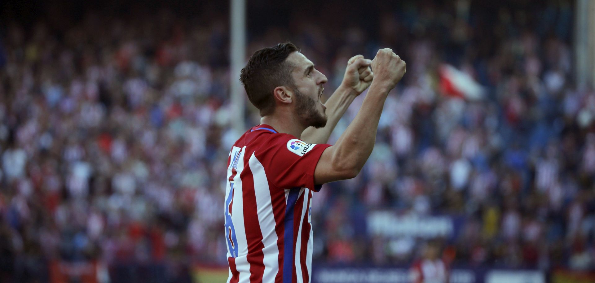 epa05858437 Atletico de Madrid's Koke Resurreccion celebrates after scoring the team's third goal against Sevilla during their Spanish Primera Division soccer game at Vicente Calderon stadium, in Madrid, Spain, 19 March 2017. Atletico de Madrid won 3-1.  EPA/KIKO HUESCA