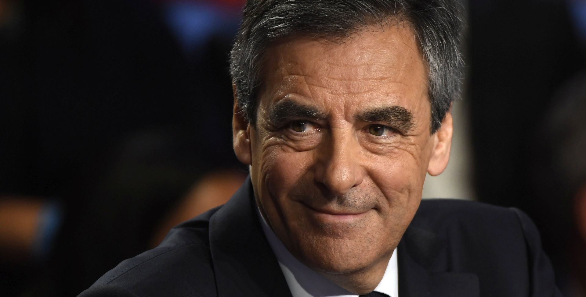 epa05888867 French presidential election candidate for the right-wing Les Republicains (LR) party Francois Fillon smiles during a debate organised by the French private TV channels BFM TV and CNews, between the eleven candidates for the French presidential election, in La Plaine-Saint-Denis, France, 04 April 2017. The French presidential election is scheduled for 23 April and 07 May 2017.  EPA/LIONEL BONAVENTURE / POOL MAXPPP OUT