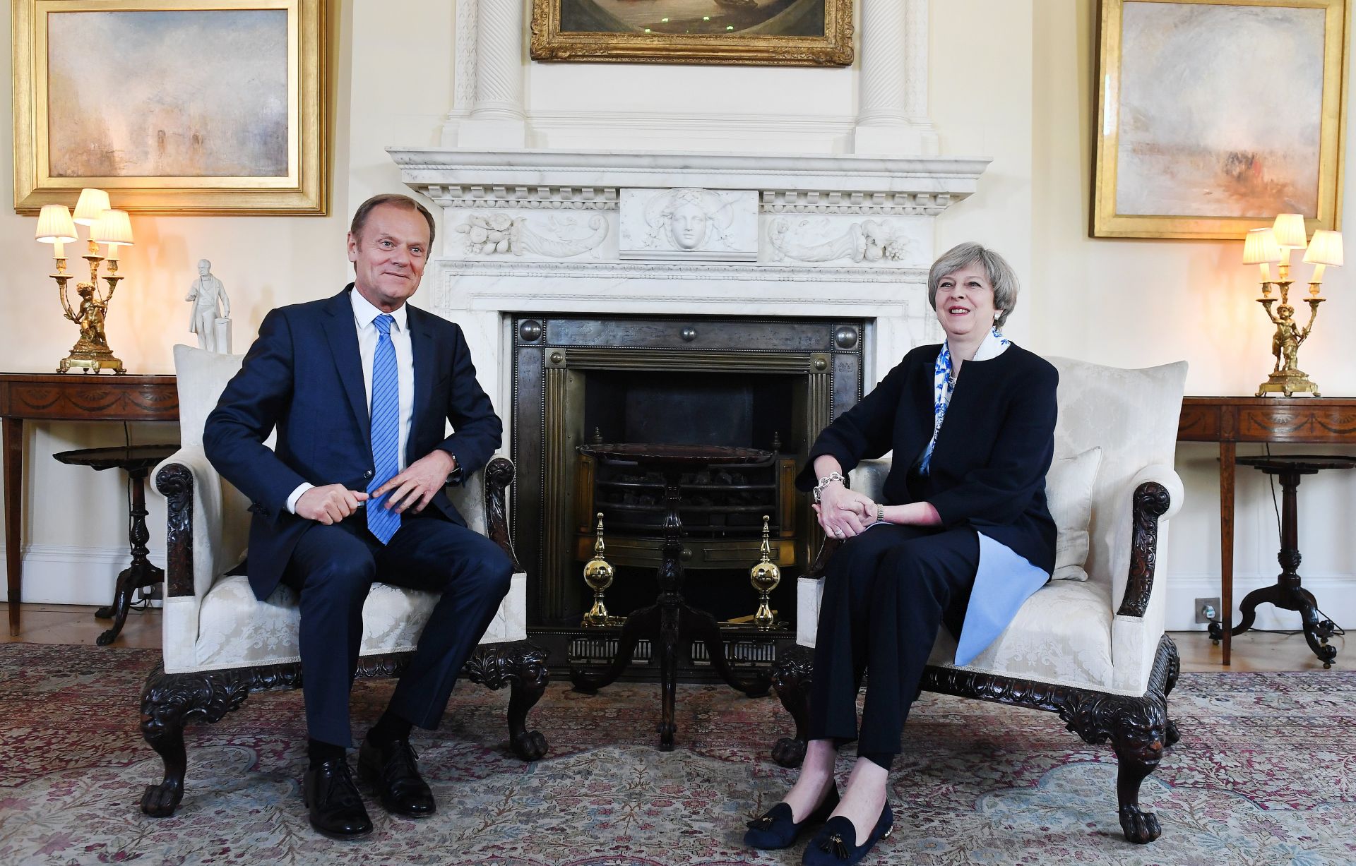epa05891963 British Prime Minister Theresa May (R) welcomes European Council President Donald Tusk (L) to 10 Downing Street in London, Britain, 06 April 2017. The two leaders held talks on Brexit negotiations.  EPA/ANDY RAIN / POOL