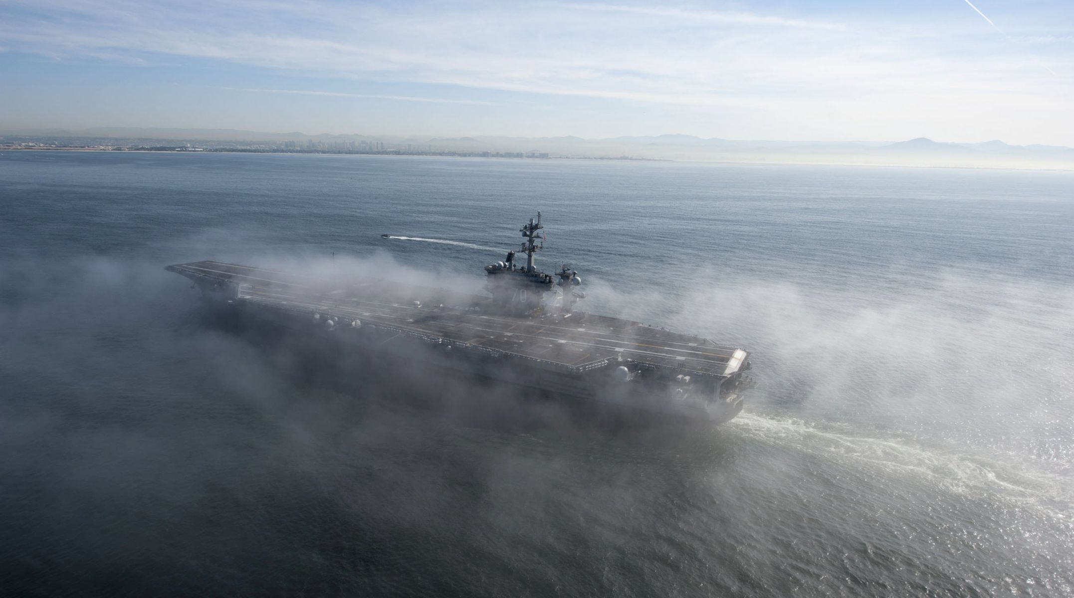 epa05898240 (FILE) - A handout picture made available by the US Navy Media Content Service on 11 April 2014 show aircraft carrier USS Carl Vinson (CVN 70) passing through a fog bank on the Pacific Ocean during a transit to homeport at Naval Air Station North Island, California, USA, 10 April 2014 (reissued 09 April 2017). According to media reports on 09 April 2017, the Carl Vinson US Navy Strike Group, which includes the USS Carl Vinson (CVN 70), is moving toward the Korean peninsula to provide a 'show of force' against North Korea in the wake of North Korean ballistic missile tests and reported increased activity at North Korea's nuclear test site.  EPA/MC3 SHANTECE GONZALEZ/US NAVY/ H  HANDOUT EDITORIAL USE ONLY HANDOUT EDITORIAL USE ONLY