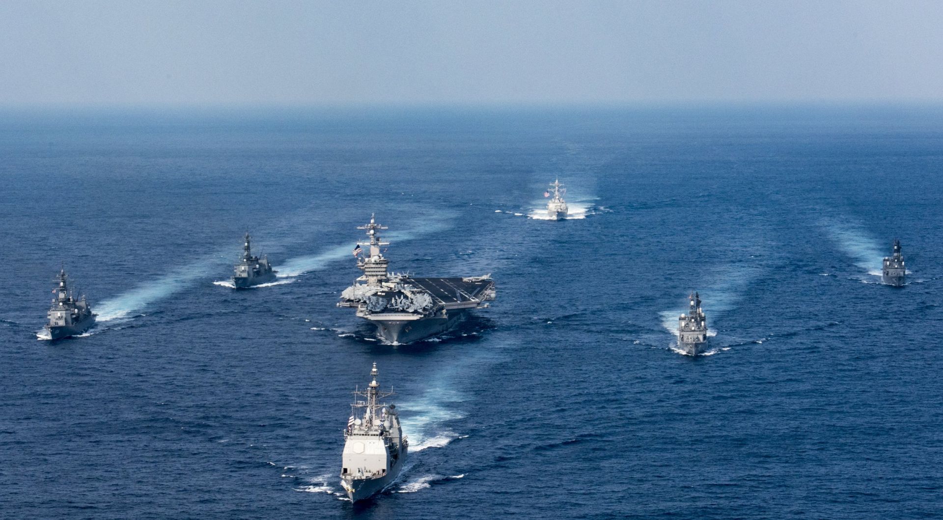 epa05898649 A handout photo made available by the US Navy on 09 April 2017 showing the US Navy aircraft carrier USS Carl Vinson (CVN 70), the guided-missile destroyer USS Wayne E. Meyer (DDG 108) and the guided-missile cruiser USS Lake Champlain (CG 57) participate in a photo exercise with Japan Maritime Self-Defense Force destroyers in the Philippine Sea 28 March  2017. According to media reports on 09 April 2017, the Carl Vinson US Navy Strike Group, which includes the USS Carl Vinson (CVN 70), is moving toward the Korean peninsula to provide a 'show of force' against North Korea in the wake of North Korean ballistic missile tests and reported increased activity at North Korea's nuclear test site.  EPA/MCS 3RD CLASS MATT BROWN / US NAVY/ HANDOUT  HANDOUT EDITORIAL USE ONLY/NO SALES