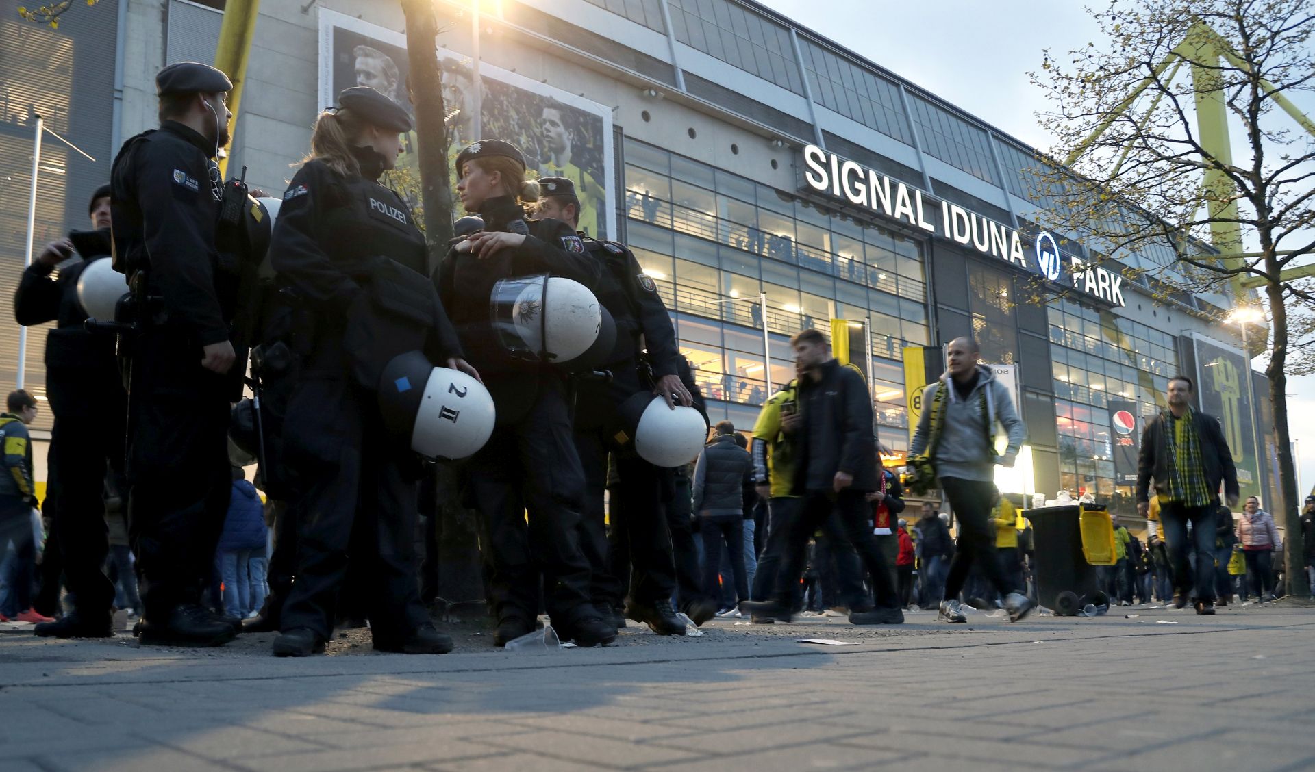 epa05903429 Police patrol arround the stadium in Dortmund, Germany, 11 April 2017. According to reports, Borussia Dortmund's team bus was damaged by three explosions on 11 April, as it was on its way to the stadium ahead of the UEFA Champions League soccer match between Borussia Dortmund and AS Monaco. Borussia Dortmund's player Marc Bartra was injured and is hospitalized. The match has been postponed.  EPA/FRIEDEMANN VOGEL
