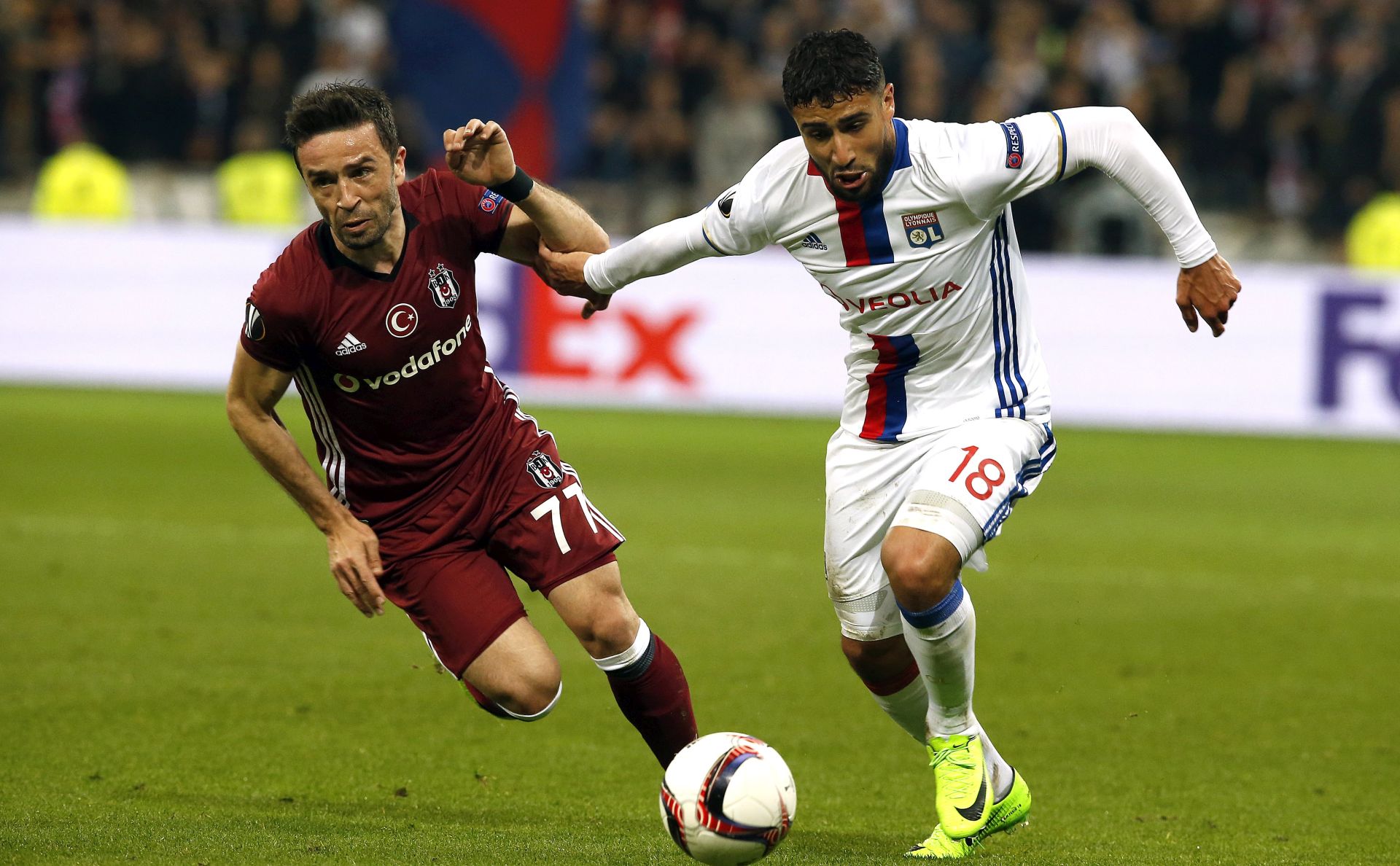 epa05906790 Nabil Fekir of Olympique Lyon (R) vies for the ball with Gokhan Gonul of Besiktas (L) during the UEFA Europa League quarter final, first leg soccer match between Olympique Lyon and Besiktas Istanbul, at Parc Olympique Lyonnais stadium in Lyon, France, 13 April 2017.  EPA/SEBASTIEN NOGIER