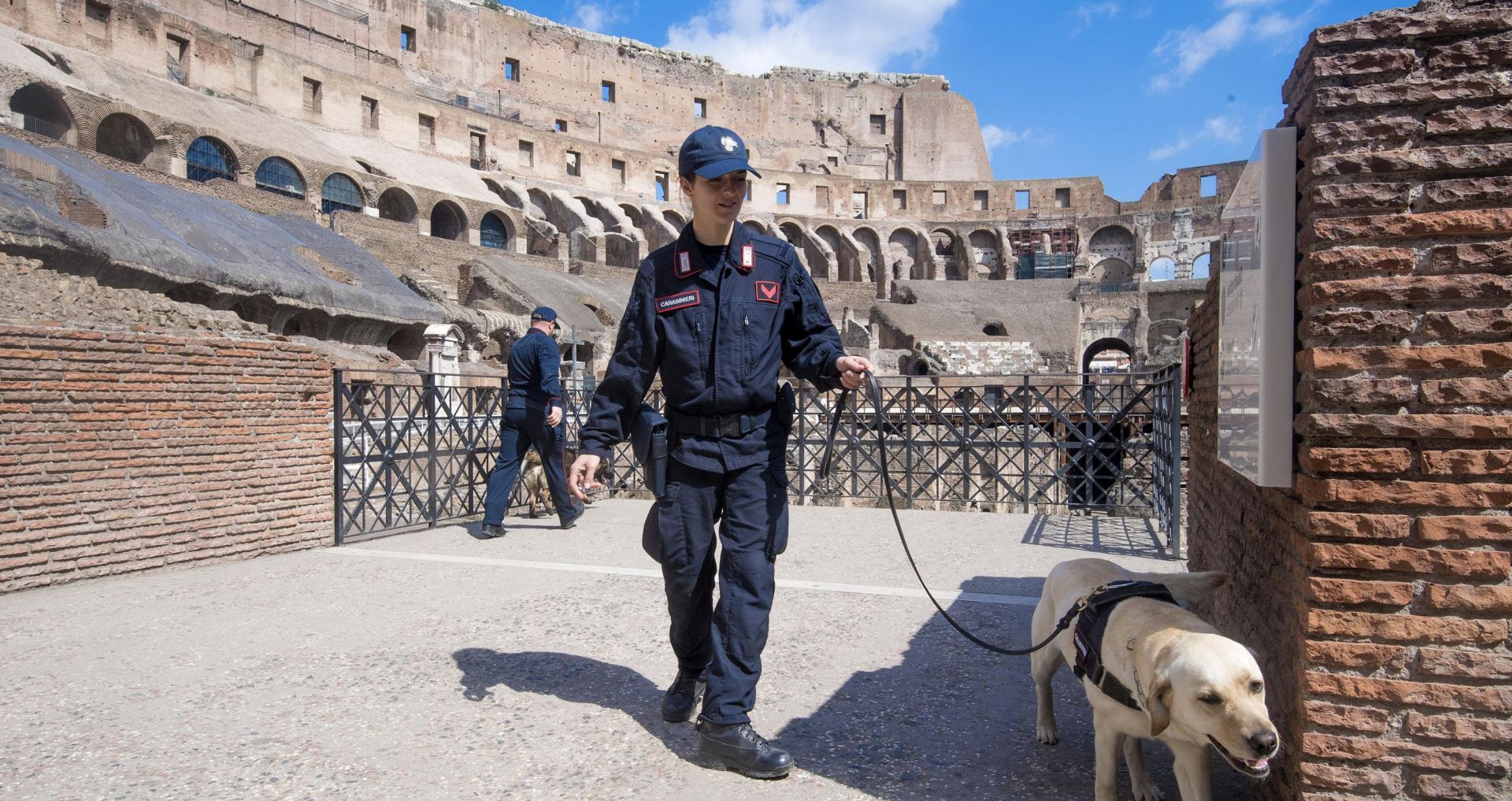 epa05907852 A police officer patrols with his dog before Pope Francis leads the "Via Crucis" (Way of the Cross) procession, which commemorates the crucifixion of Jesus Christ at the Colosseum in Rome, Italy, 14 April 2017. Good Friday is observed by Christians around the world to commemorate the crucifixion of Jesus Christ.  EPA/CLAUDIO PERI