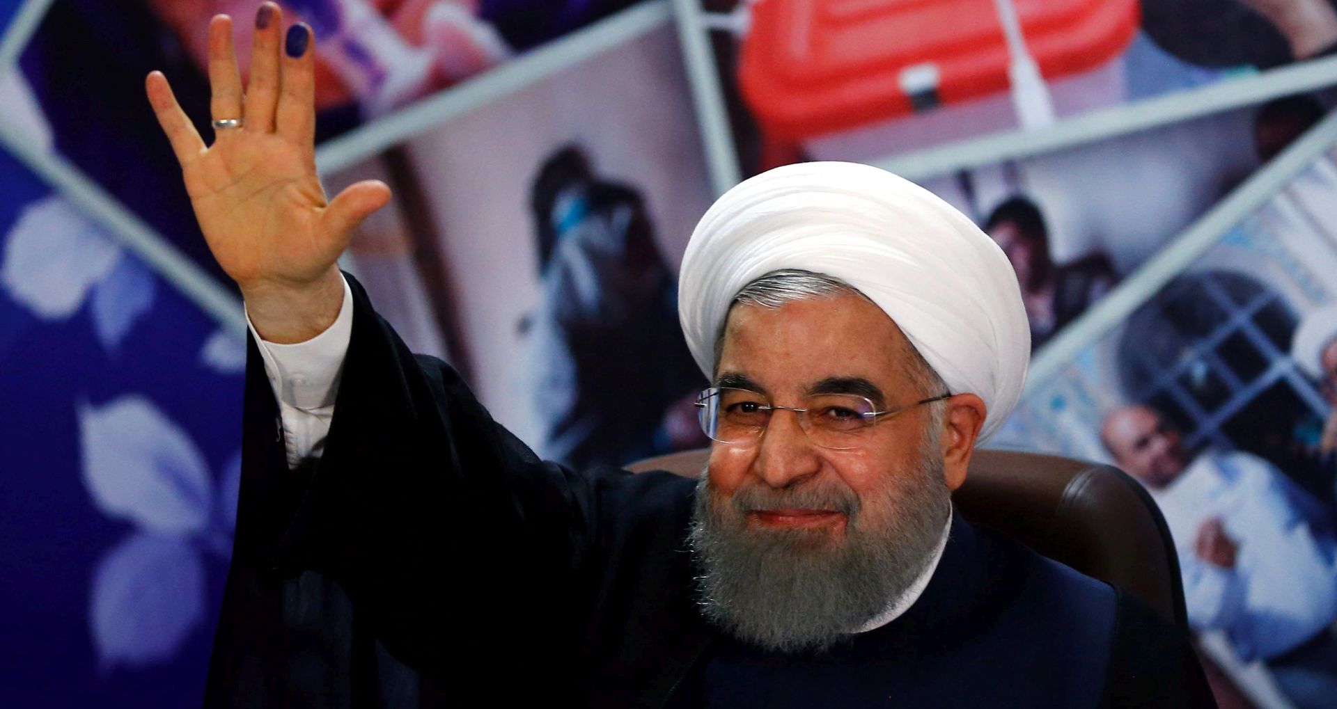 epa05907456 Iranian President Hassan Rouhani wave to the media after he register his candidacy for Iran's upcoming presidential elections on 19 May, at the interior ministry in Tehran, Iran, 14 April 2017. Media reported that registration for candidates started on 11 April at the Ministry of Interior and will continue for five days.  EPA/ABEDIN TAHERKENAREH