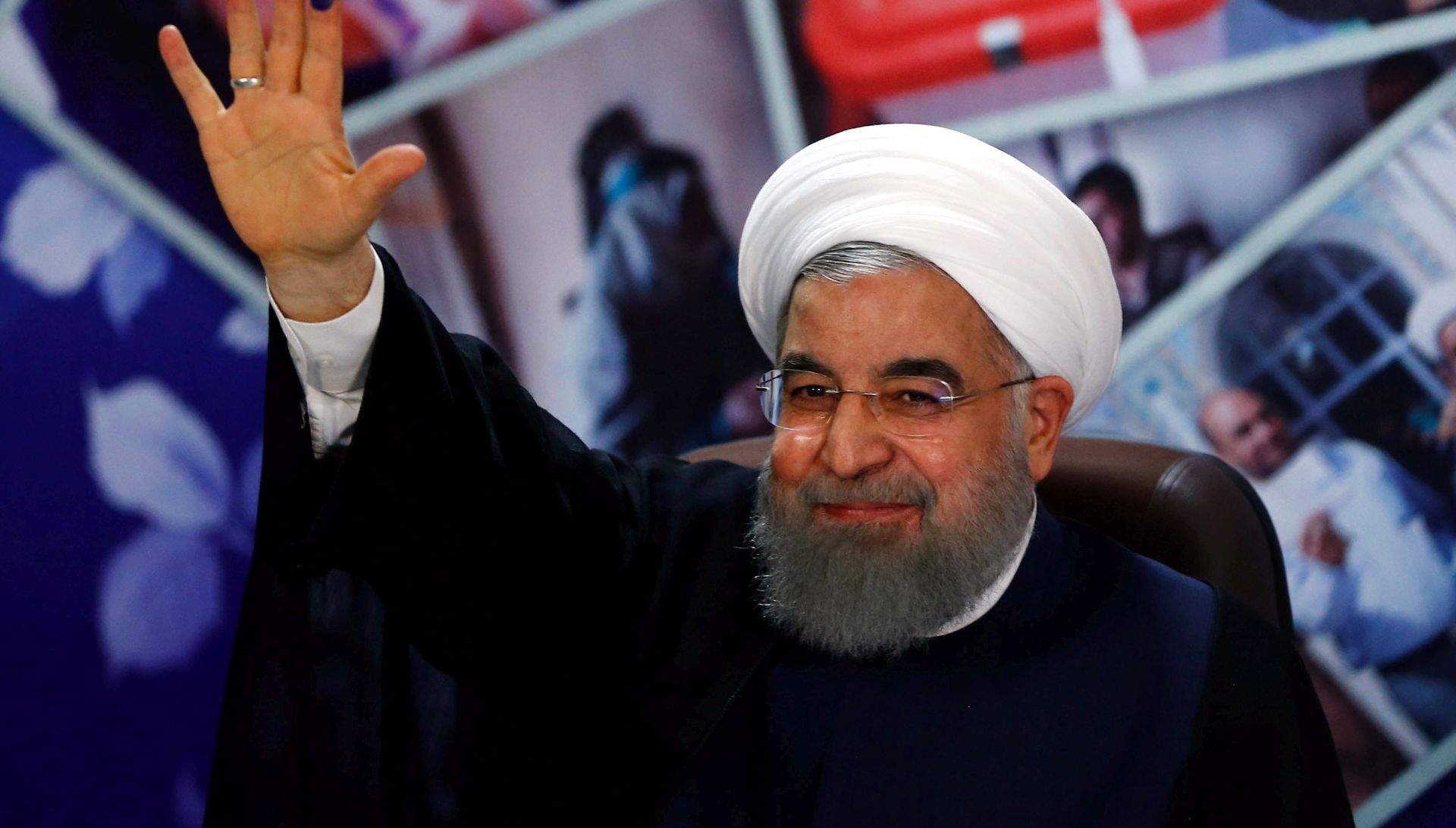 epa05907456 Iranian President Hassan Rouhani wave to the media after he register his candidacy for Iran's upcoming presidential elections on 19 May, at the interior ministry in Tehran, Iran, 14 April 2017. Media reported that registration for candidates started on 11 April at the Ministry of Interior and will continue for five days.  EPA/ABEDIN TAHERKENAREH