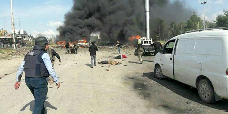 epa05909595 A handout photo made available by Syrian Arab News Agency (SANA) showing victims of a car bomb attack that targeted buses evacuating civilians from besieged towns, al-Rashideen area, west of Aleppo, Syria, 15 April 2017. According to media reports at least 24 people were killed when a suicide car attacked buses transporting civilians from Kefraya and al-Foua'a towns to al-Rashideen area near Aleppo.  EPA/SANA HANDOUT BEST QUALITY AVAILABLE HANDOUT EDITORIAL USE ONLY/NO SALES