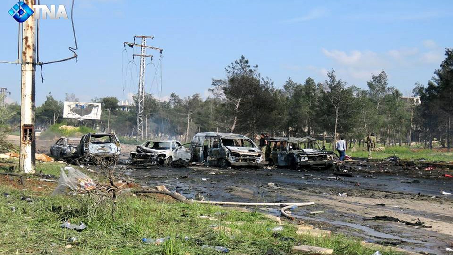 epa05909714 A handout photo made available by Thiqa News Agency (TNA) showing damages to the buses convoy evacuating civilians from besieged towns that was targeted by a car bomb attack, al-Rashideen area, west of Aleppo, Syria, 15 April 2017. According to media reports at least 24 people were killed when a suicide car attacked buses transporting civilians from Kefraya and al-Foua'a towns to al-Rashideen area near Aleppo.  EPA/TNA HANDOUT  HANDOUT EDITORIAL USE ONLY/NO SALES