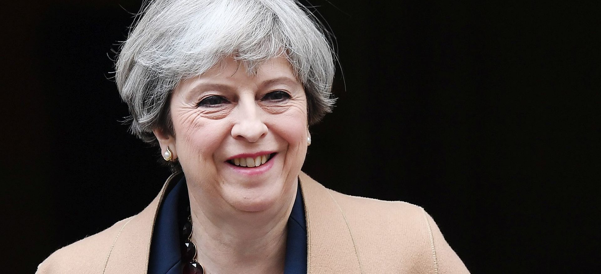 epa05928557 British Prime Minister Theresa May departs 10 Downing Street for Prime Ministers questions at parliament in London, Britain, 26 April 2017. May has called a snap general election for 08 June.  EPA/ANDY RAIN