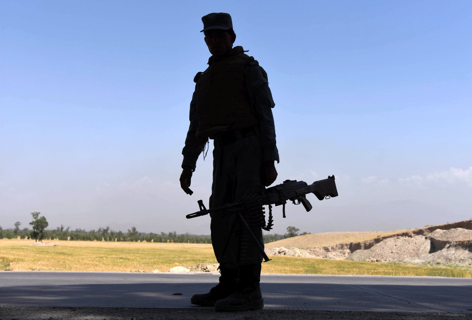epa05932218 An Afghan security official stands guard on a roadside as security has been high intensified after Taliban announced the start of their annual spring offensive, in Jalalabad, Afghanistan, 28 April 2017.  According to media reports, Taliban spokesman Zabihullah Mujahid announced the launch of the spring offensive on 28 April. A report issued by Washington's special inspector general for Afghan reconstruction in February said that the Afghan government had control over only 52 percent of Afghanistan's 407 districts last year, down from 63.4 percent previously.  EPA/GHULAMULLAH HABIBI
