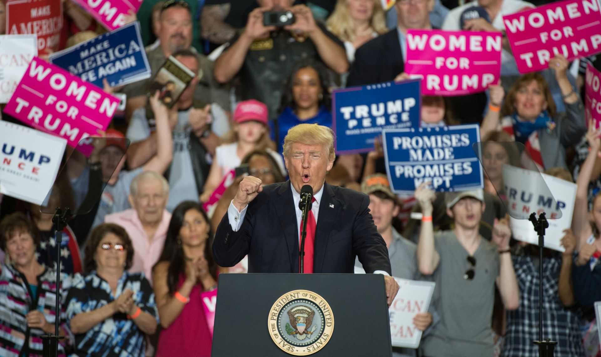 epa05936301 US President Donald J. Trump makes fist as he speaks at the Pennsylvania Farm Show Complex in Harrisburg, Pennsylvania, USA, 29 April 2017. The rally marked the president's 100th day in office.  EPA/TRACIE VAN AUKEN