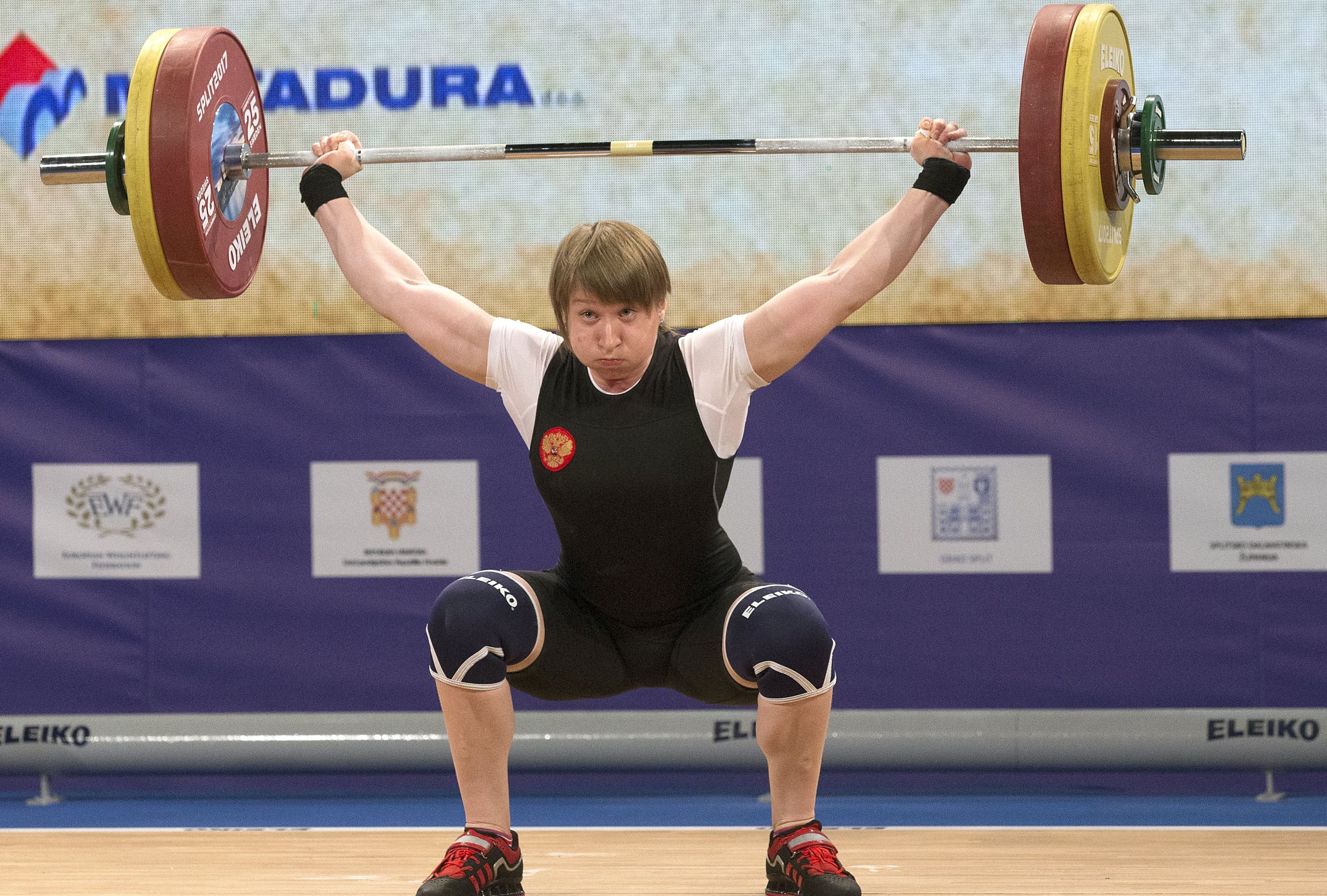 epa05890602 Anastasia Romanova of Russia makes an attempt during the women's 69kg category of the Weightlifting European Championships 2017 in Split, Croatia, 05 April 2017. Romanova won the gold medal.  EPA/ANTONIO BAT