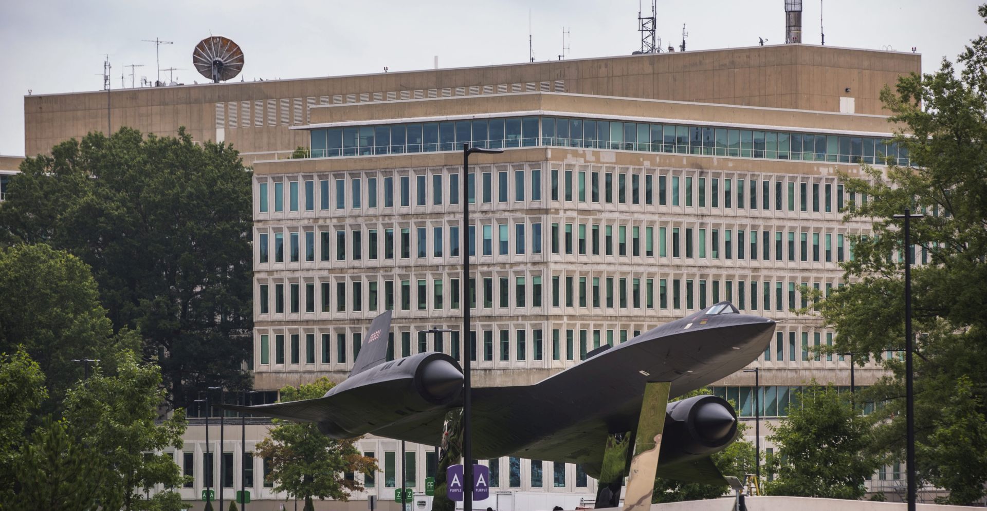 epa04317305 The headquarters of the Central Intelligence Agency (CIA), along with an A-12 supersonic reconnaissance aircraft on display for viewing, is visible from the Agency's north parking lot in McLean, Virginia, USA, 15 July 2014.  EPA/JIM LO SCALZO