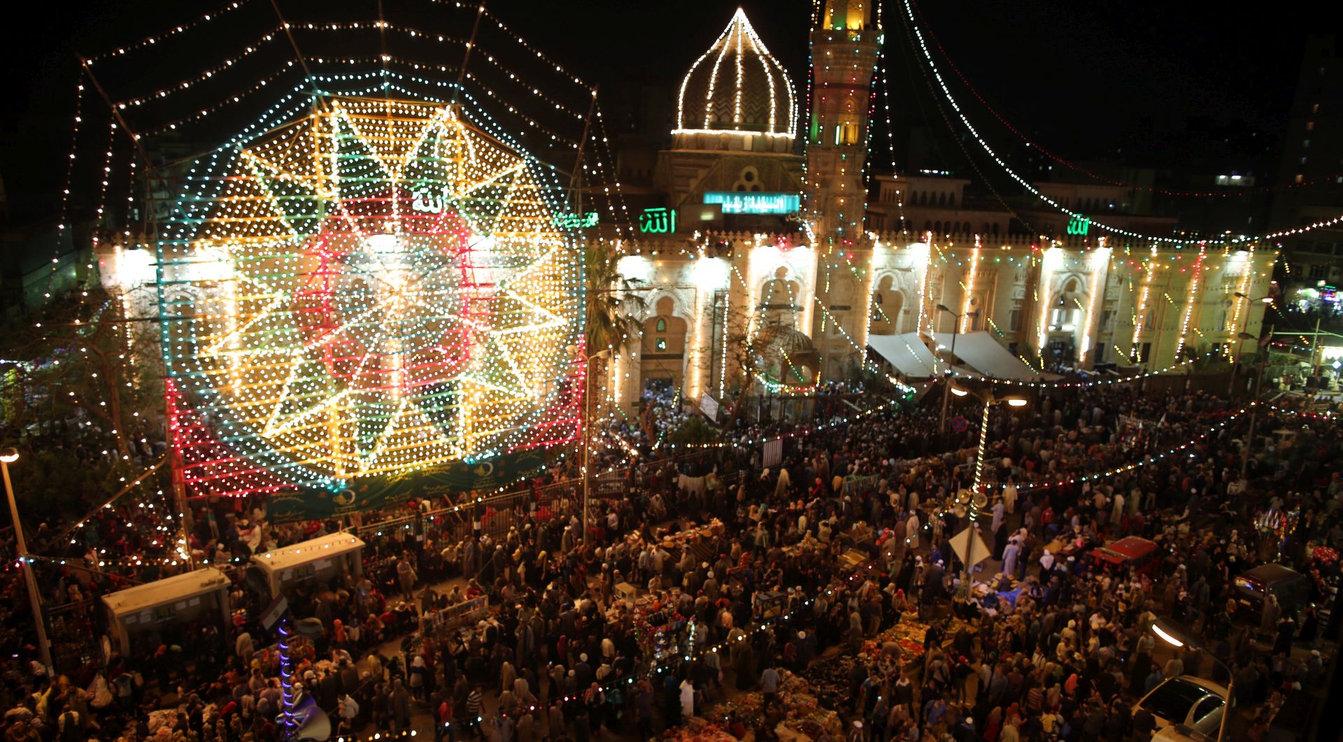 epa05927782 People celebrate during an annual Al-Sayeda Zeinab Mawlid celebration in Cairo, Egypt 25 April 2017. Mawlid, meaning birthday in Arabic, is a celebration of a holy person. It is celebrated by Muslims and Christians in Egypt to honor their Saints. Although most Mawlids are Muslim, some Coptic Saints are also honored in similar celebrations.  EPA/KHALED ELFIQI