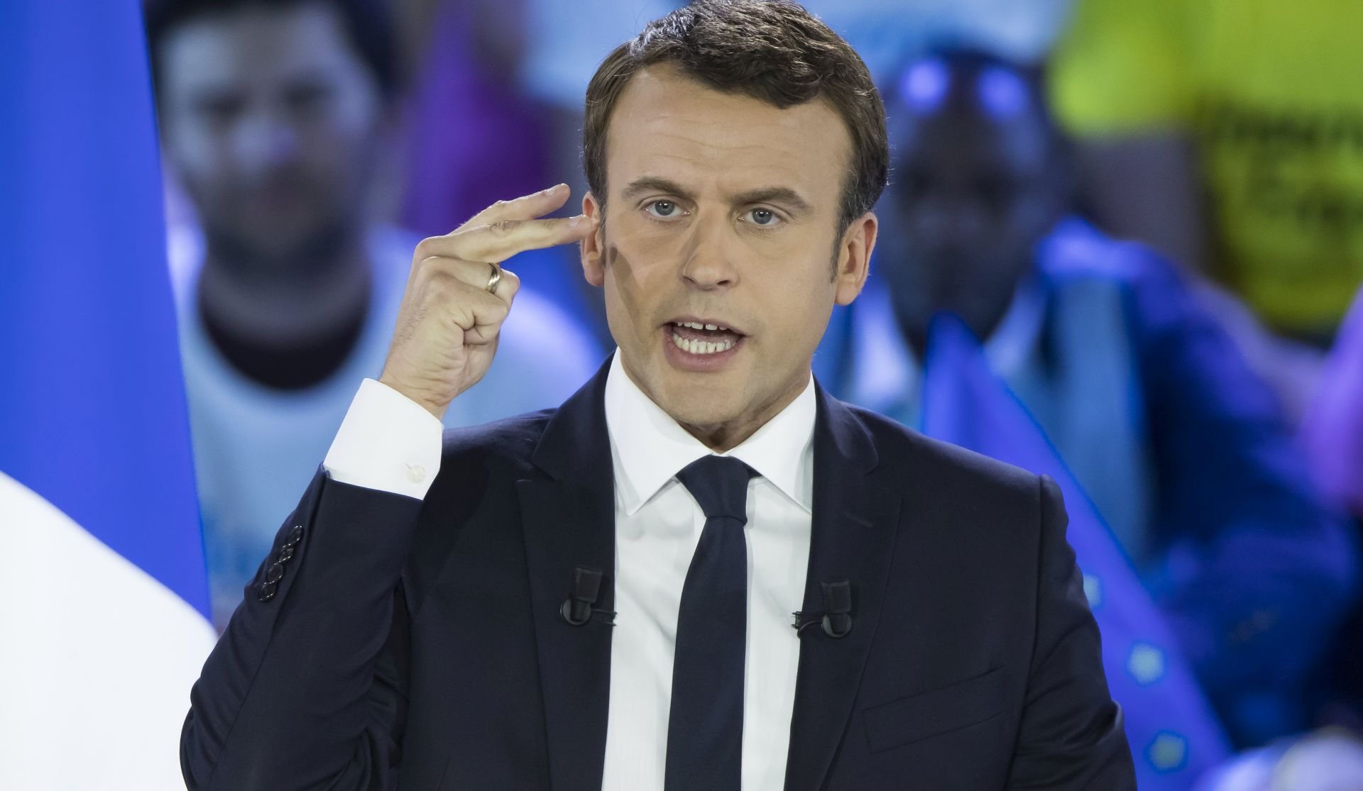epa05939374 French presidential election candidate for the 'En Marche!' (Onwards!) political movement, Emmanuel Macron  delivers his speech during a rally in Paris, France, 01 May 2017. Far-right Front National (FN) party candidate Marine Le-Pen and 'En Marche!' (Onwards!) party candidate Emmanuel Macron arrived in the lead positions in the first round of the presidential elections. France will hold the second round on 07 May 2017.  EPA/IAN LANGSDON