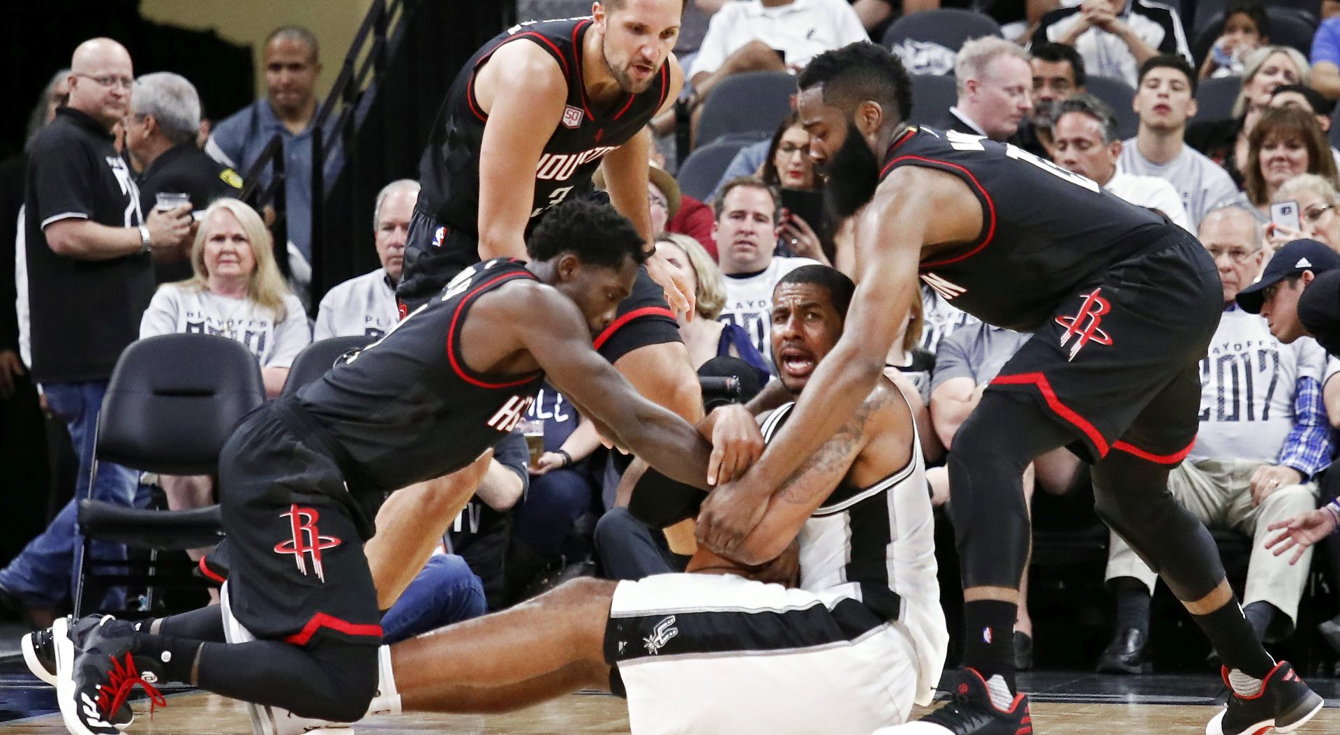 epa05940079 Houston Rockets players James Harden (R), Patrick Beverley (L) and Ryan Anderson (B) go for the ball against San Antonio Spurs forward LaMarcus Aldridge (C) in the second half of the NBA basketball Western Conference Semi-Finals playoff game one between the Houston Rockets and the San Antonio Spurs at the AT&T Center in San Antonio, Texas, USA, 01 May 2017.  EPA/LARRY W. SMITH