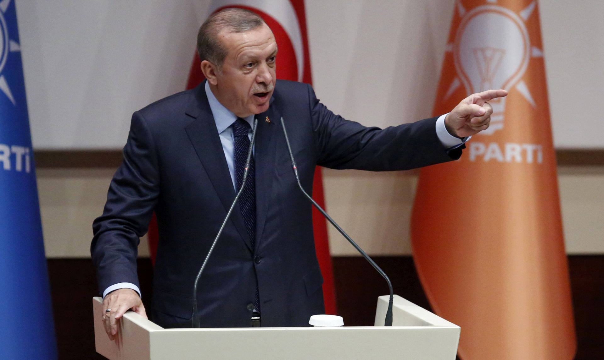 epa05940583 Turkish President Recep Tayyip Erdogan speaks after Erdogan rejoined Turkey's ruling Party Justice and Development Party (AKP) during a ceremony in Ankara, Turkey 02 May 2917. Erdogan rejoined the ruling party he co-founded, following his victory in a referendum that expands the powers of the president. Most of the constitutional changes ushering in a presidential system, approved in the April 16 referendum, will come into force in 2019.  EPA/TUMAY BERKIN