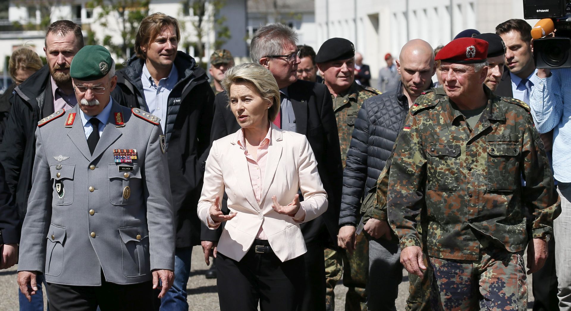 epa05941931 Federal Minister of Defense of Germany, Ursula von der Leyen, General Inspector of the German Bundeswehr, Volker Wieker (R) and Inspector of the Army, Lieutenant General Joerg Vollmer (L) during their visit at the Quartier Leclerc of barracks of infantry battalion 291 in Illkirch, France, 03 May 2017. German Defense Minister Ursula von der Leyen is to visit the Illkirch barracks following reports Nazi memorabilia and symbols such as swastikas were found in the premises during investigation to an alleged far-right terror cell in German defense forces. Media reports state German lieutenant Franco A. who was stationed at the Illkirch barracks was arrested on terror allegations in Hammelburg, Germany, last week as part of ongoing investigations. German investigators allege up to five persons may have been involved in the cell.  EPA/RONALD WITTEK