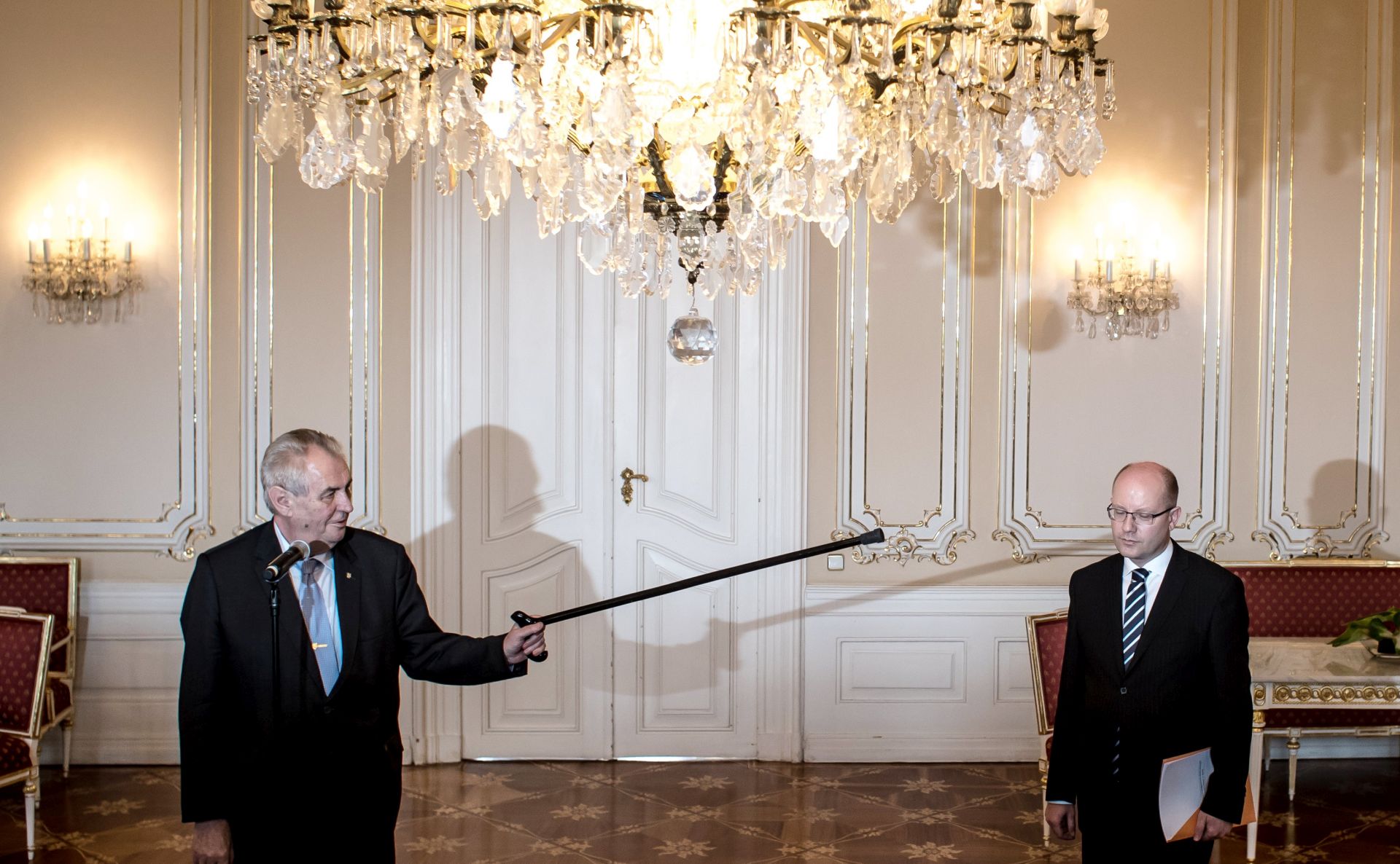 epa05943868 Czech President Milos Zeman (L) points his walking stick at Czech Prime Minister Bohuslav Sobotka (R) as he welcomes him for their talks at the Prague Castle in Prague, Czech Republic, 04 May 2017. Sobotka according to media reports on 02 April said he found it 'unbearable that Andrej Babis remained on the post of Finance Minister', after recent allegations of Babis having evaded taxes and announced that he plans to submit the resignation of his cabinet to President Zeman.  EPA/MARTIN DIVISEK